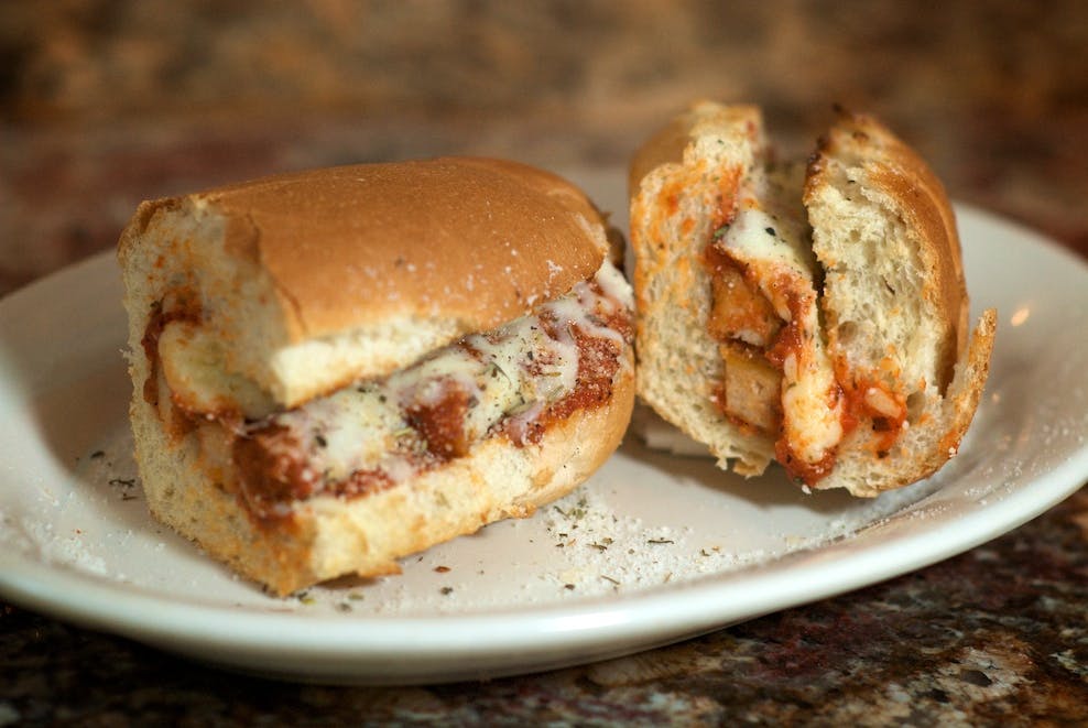 Order Eggplant Parmigiana Sub - Small food online from Golden Pizzeria store, Norfolk on bringmethat.com