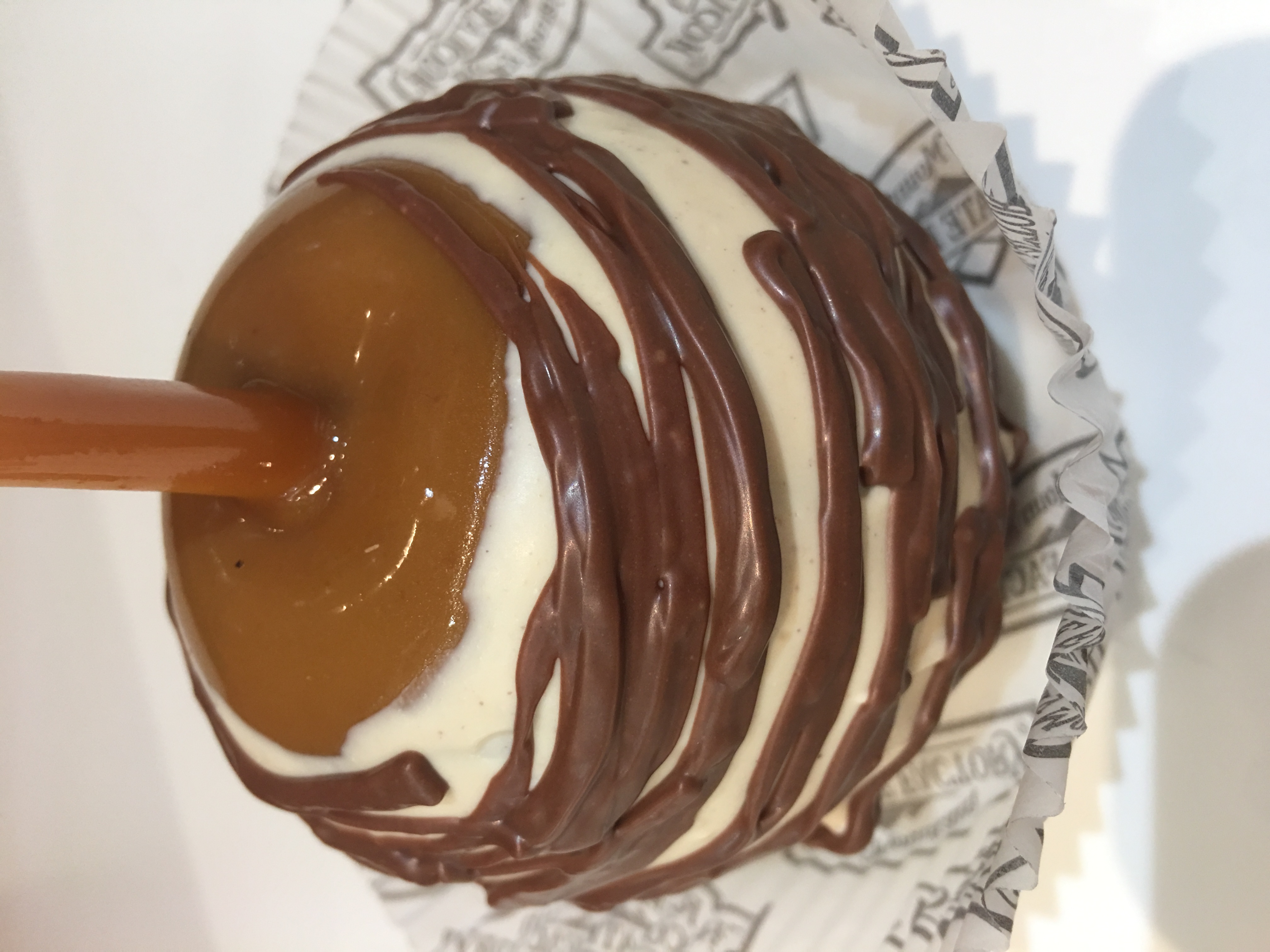 Order Tiger Butter Caramel Apple with Milk Chocolate food online from Rocky Mountain Chocolate Factory store, Redondo Beach on bringmethat.com