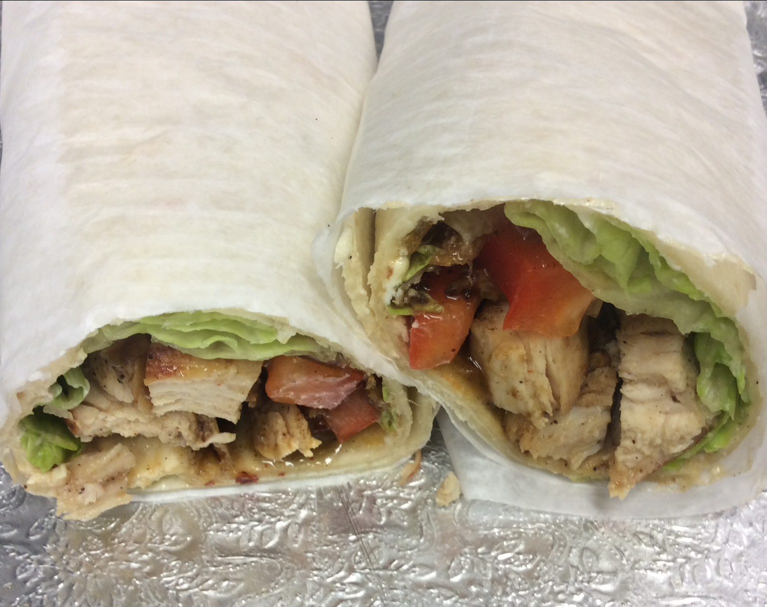 Order Jerk chicken wrap  food online from 1-11 Coffee Bar store, Chicago on bringmethat.com