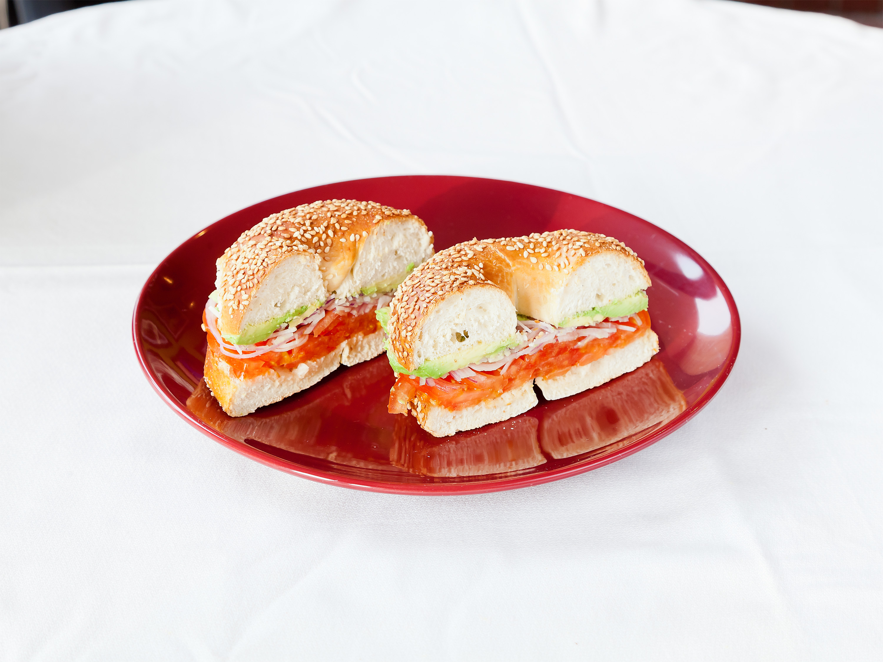 Order Bagel with Avocado, Tomato and Red Onion food online from Rossi Cafe & Deli store, Concord on bringmethat.com