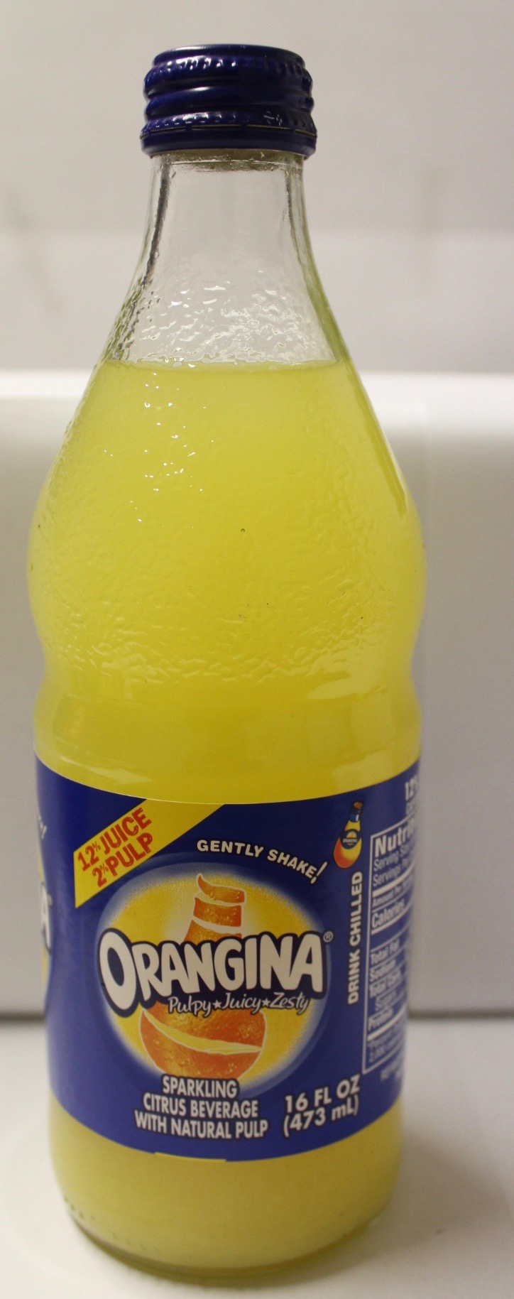 Order Orangina Sparkling Citrus with Plum  food online from Pruzzo's store, Bronx on bringmethat.com