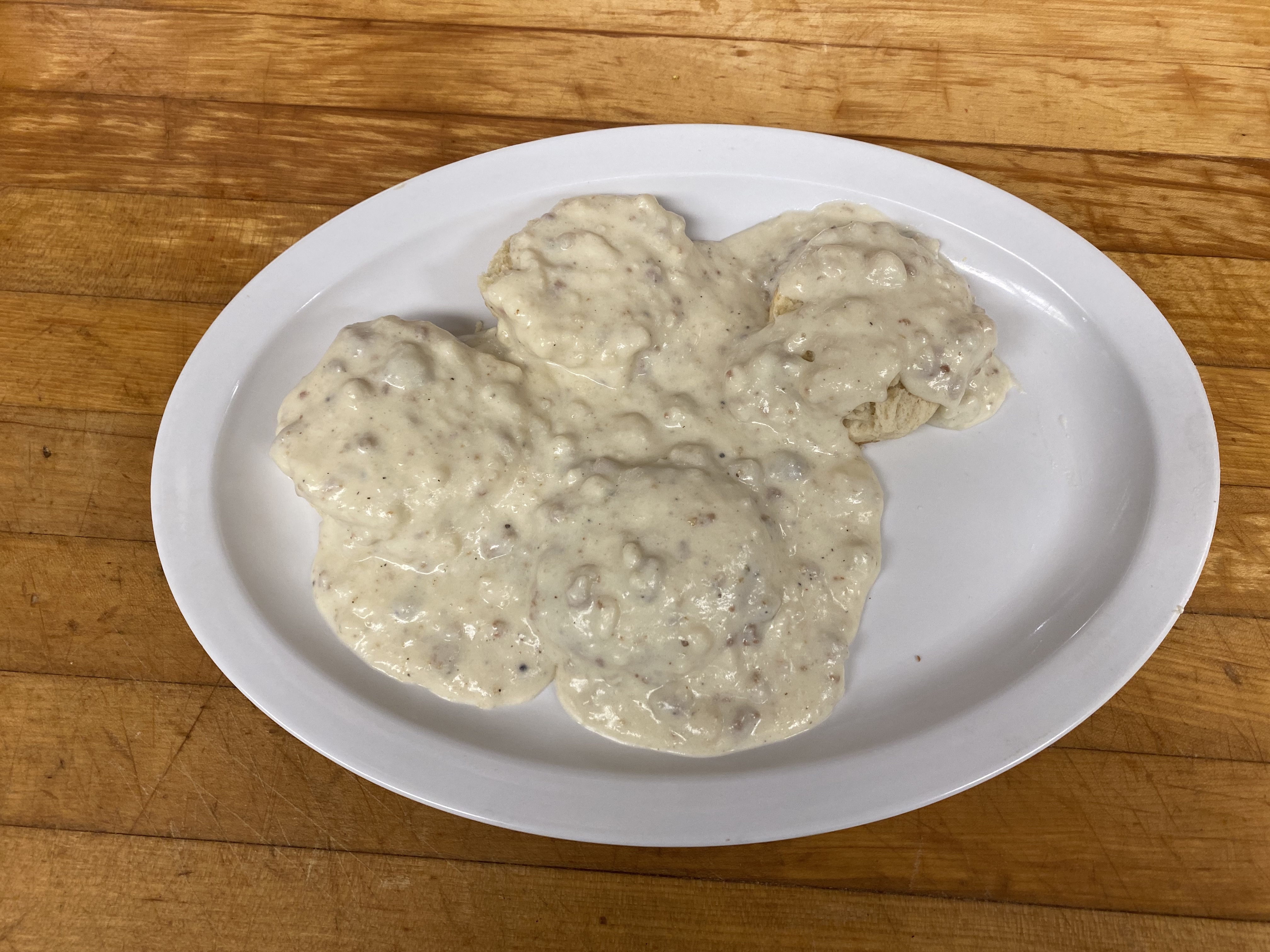 Order 2 Pieces Biscuits with Gravy food online from Papermill Place Restaurant store, Winchester on bringmethat.com