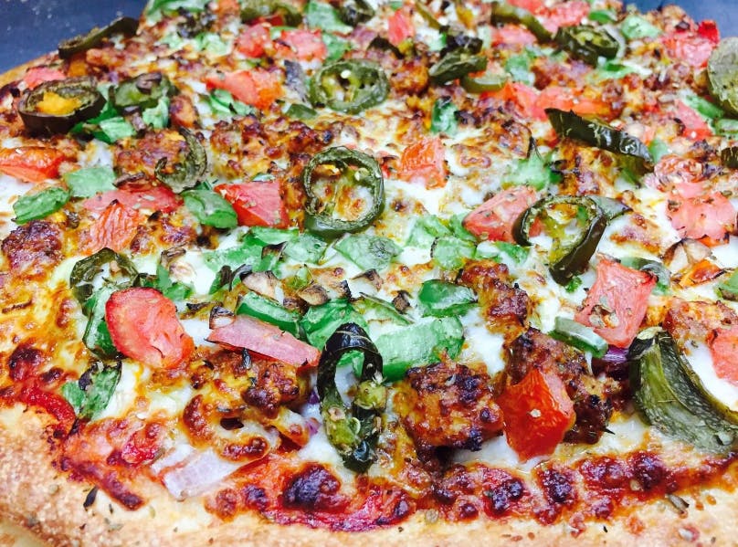 Order Karahi Paneer Veggie Pizza - Medium 12" food online from Can Am Pizza store, Federal Way on bringmethat.com