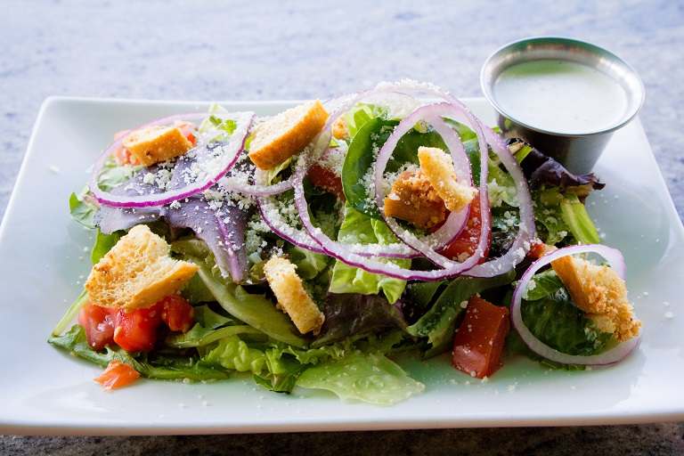 Order Green Salad food online from Leucadia Pizzeria store, Encinitas on bringmethat.com
