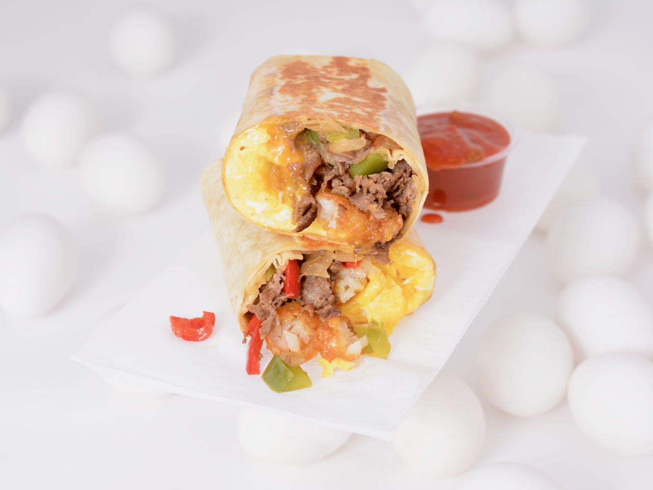 Order Philly Style Steak and Eggs Burrito  food online from Breakfast Town store, Troy on bringmethat.com