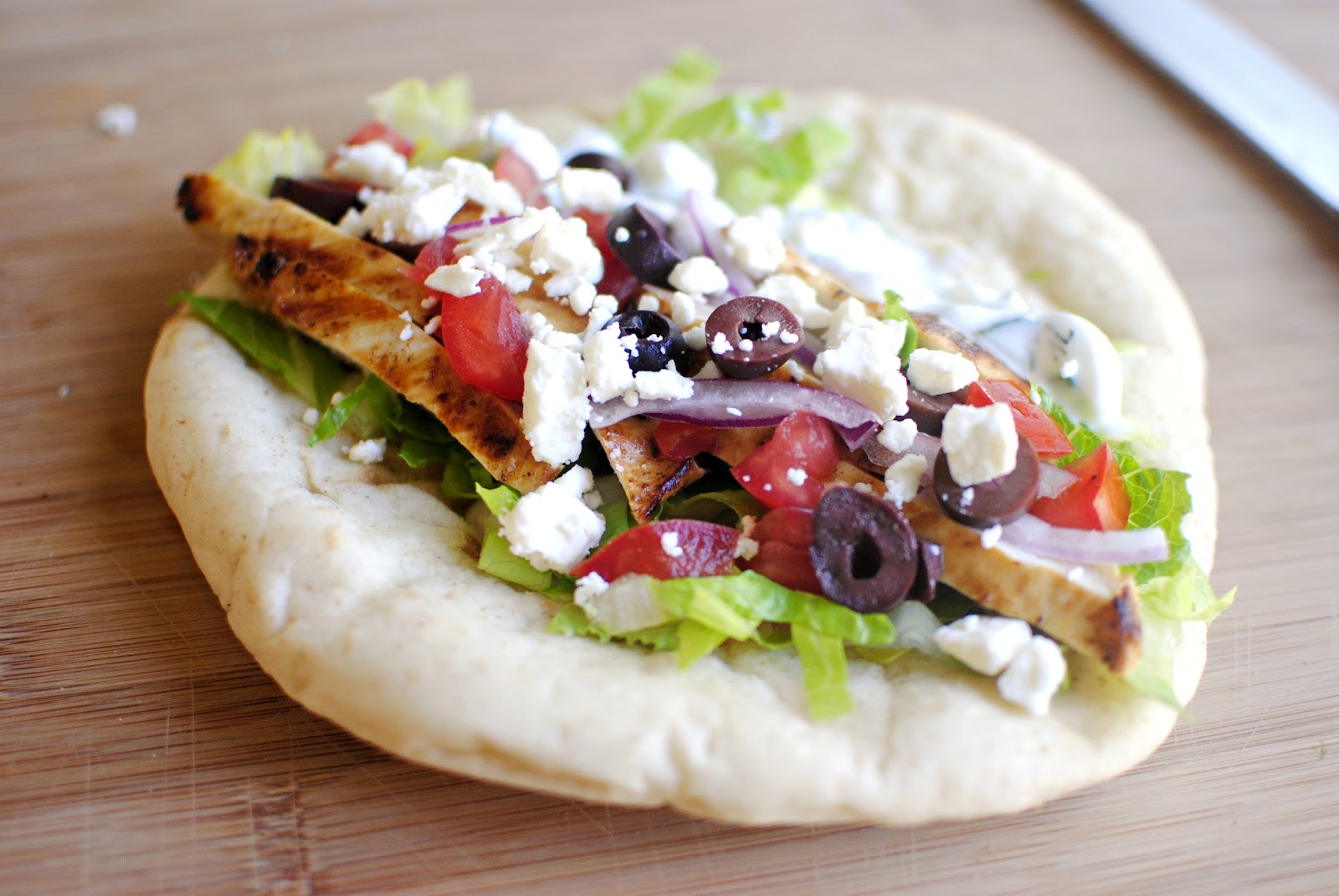 Order Greek Chicken Pita food online from Pizza fino store, Houston on bringmethat.com