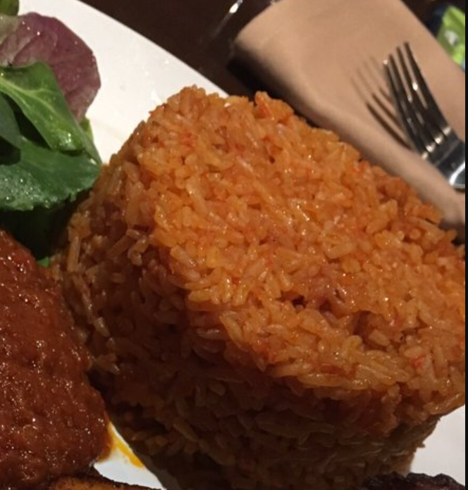 Order Jollof Rice food online from Cafe Songhai store, Norcross on bringmethat.com