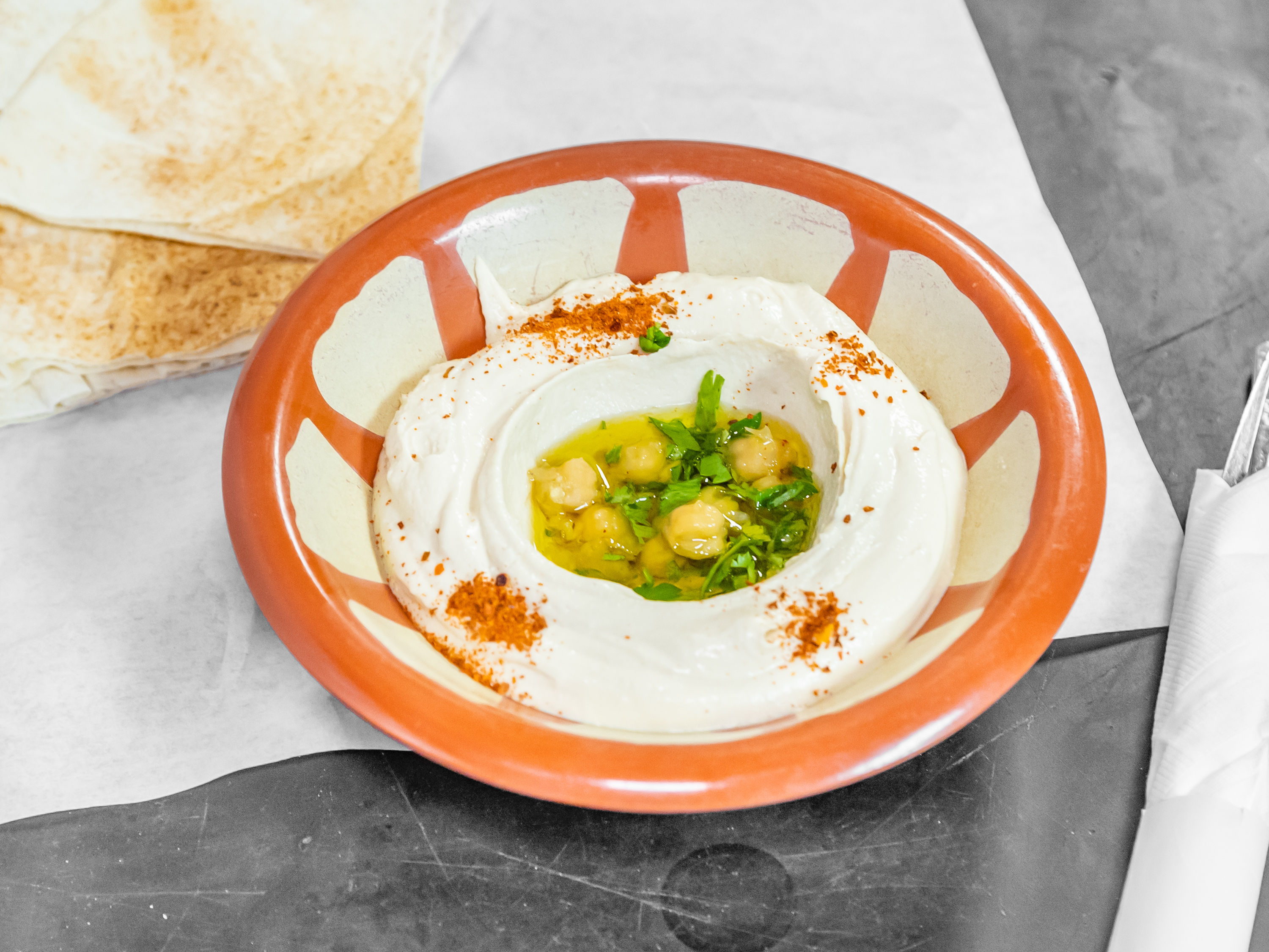 Order Hummus food online from Mazar Mediterranean Restaurant store, Woodland Hills on bringmethat.com