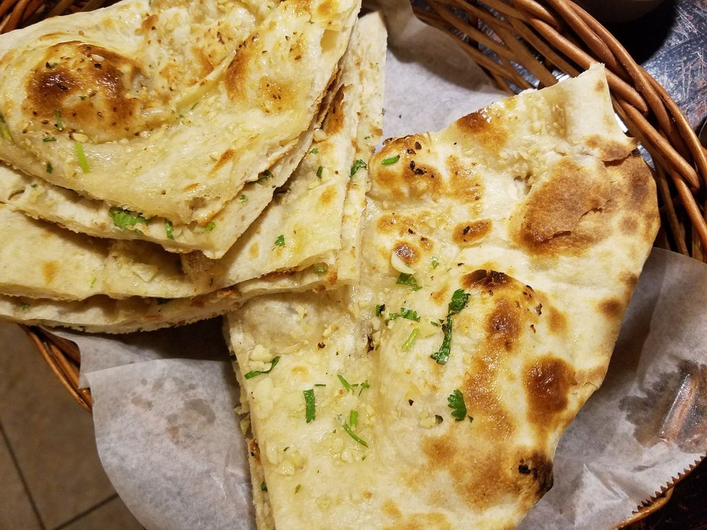 Order Garlic Naan food online from The Curry House store, Humble on bringmethat.com