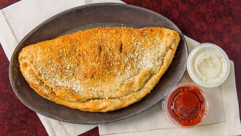 Order Calzone food online from Passport Pizza store, Sterling Heights on bringmethat.com