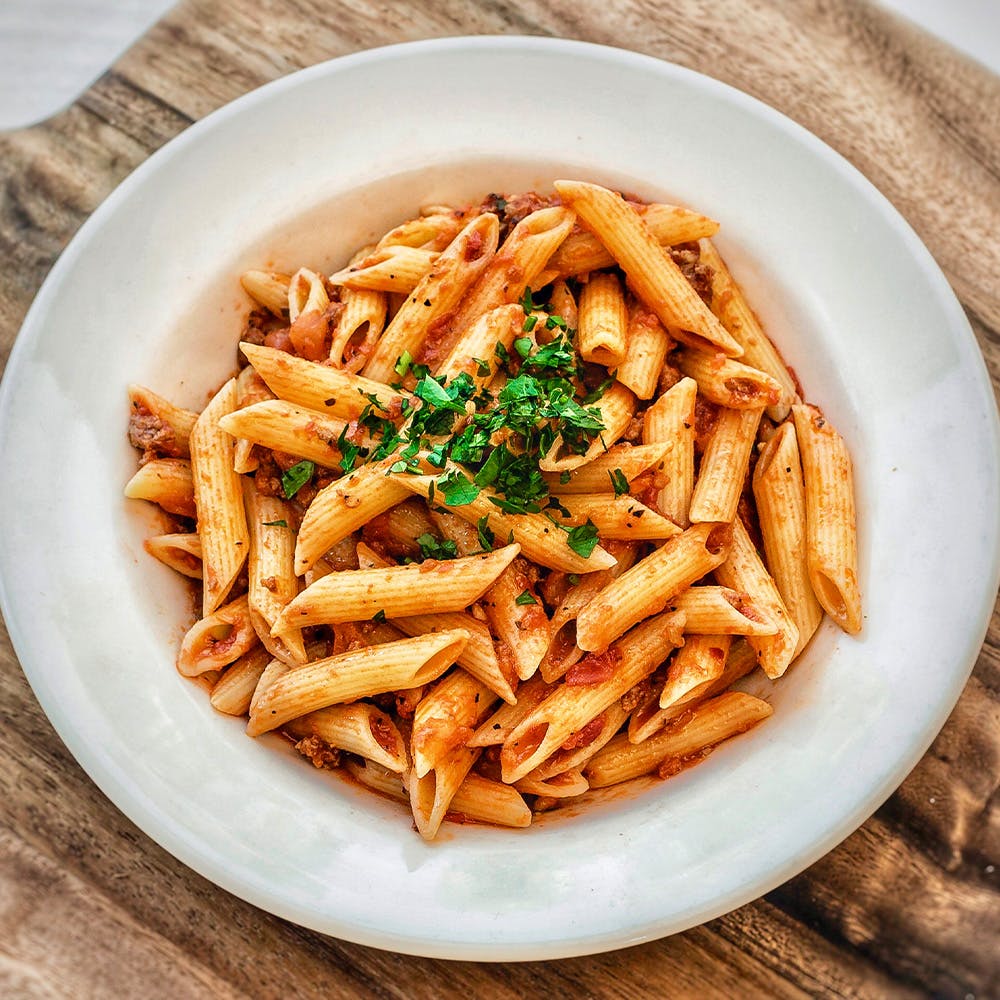 Order Penne with Meat Sauce - Small food online from Amici's East Coast Pizzeria store, Vacaville on bringmethat.com