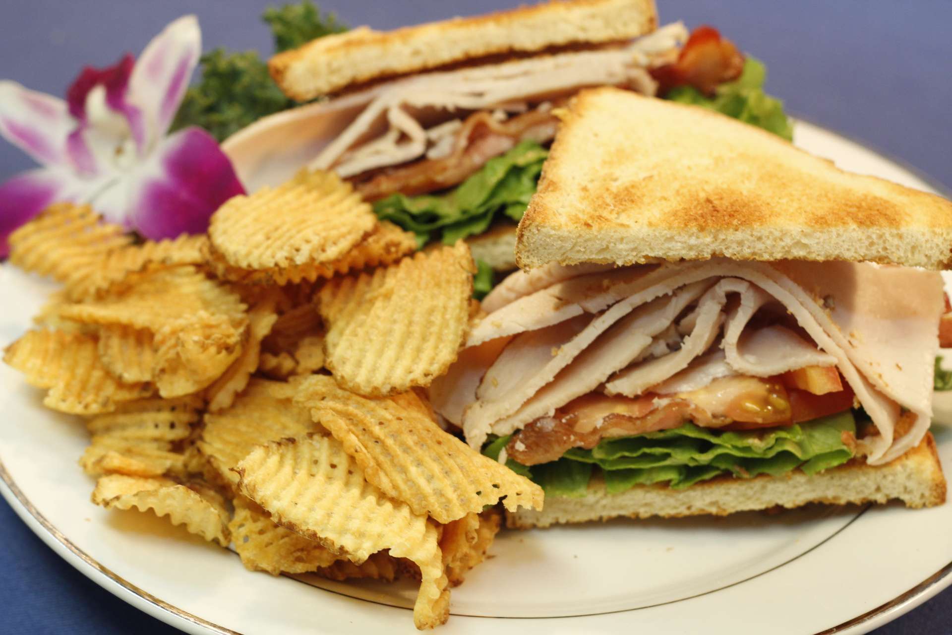 Order Turkey Club food online from Celebrations Comfort Kitchen store, Manchester on bringmethat.com