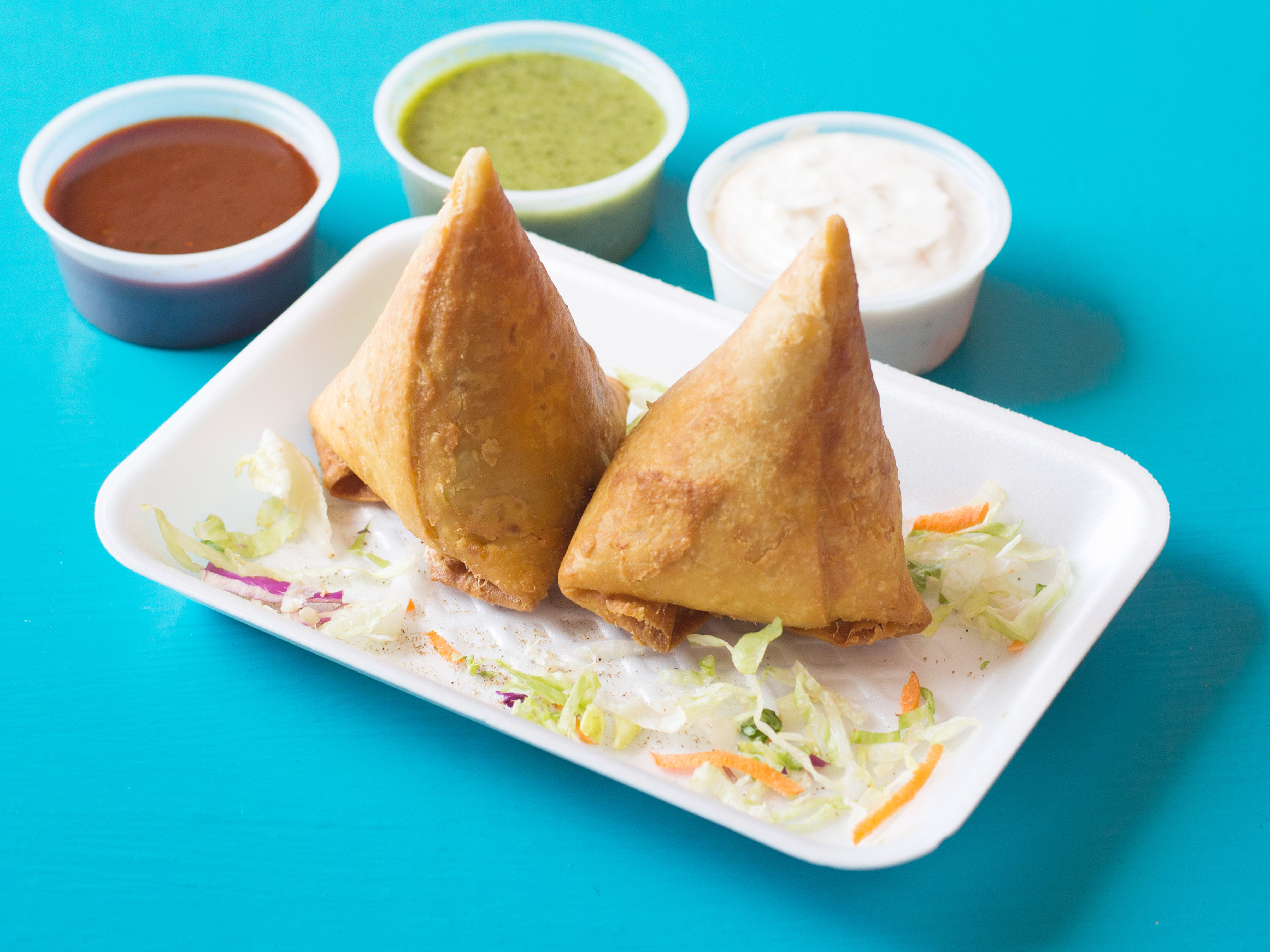 Order 2 Pieces Vegetable Samosas food online from Indimex Eats Indian Restaurant store, Los Angeles on bringmethat.com