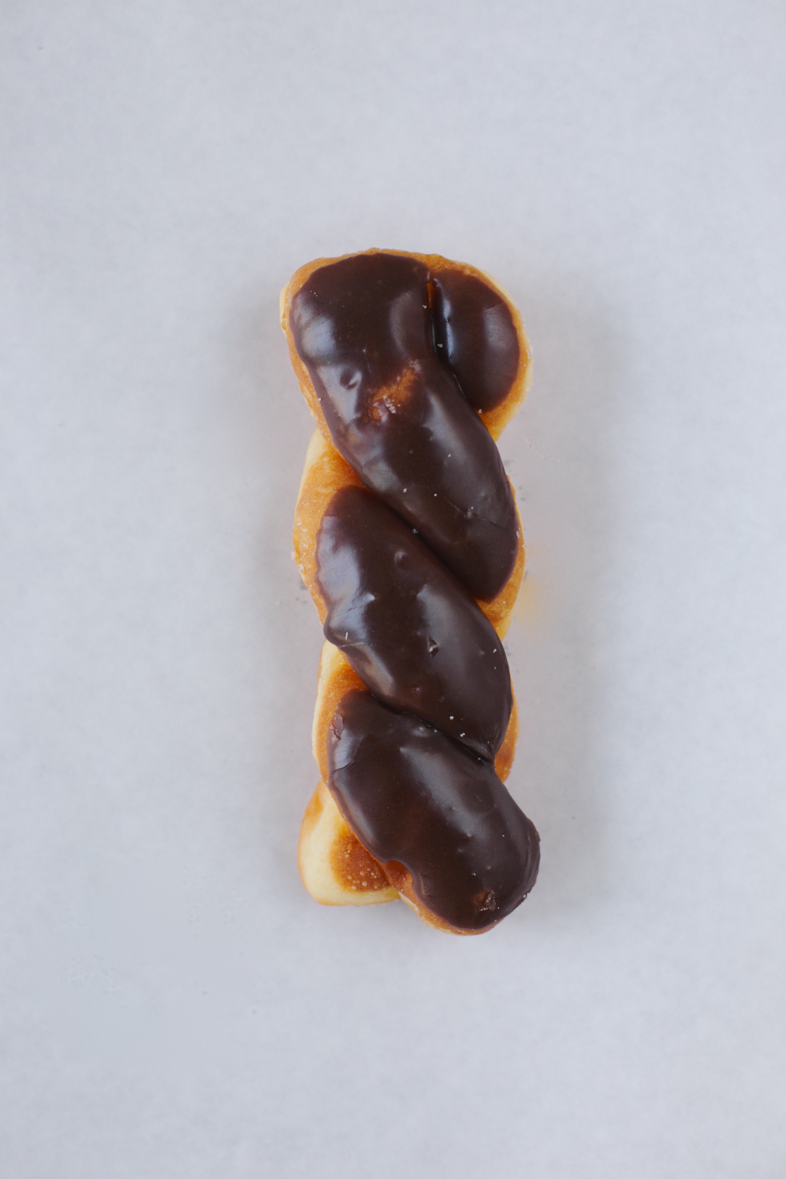 Order Chocolate Twist Donut food online from White Cup Donuts store, Gardena on bringmethat.com