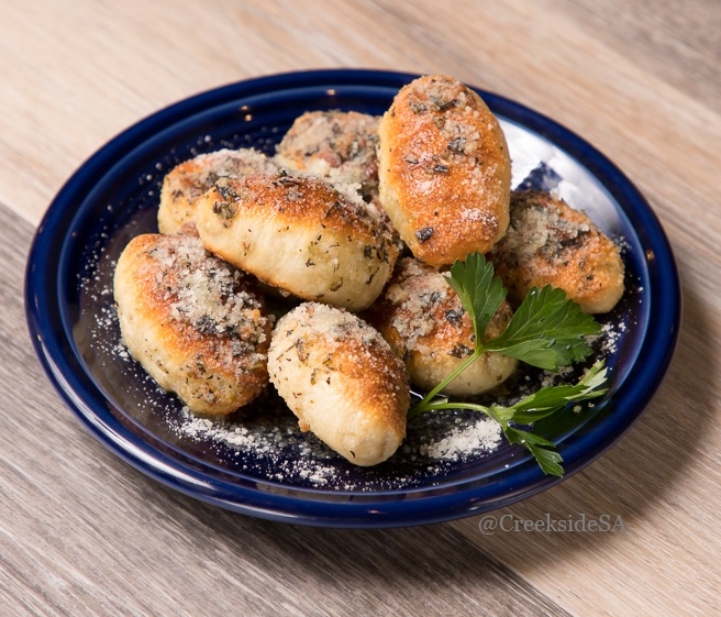 Order Garlic Parmesan Puffs food online from Creekside Pizza & Taproom store, San Anselmo on bringmethat.com