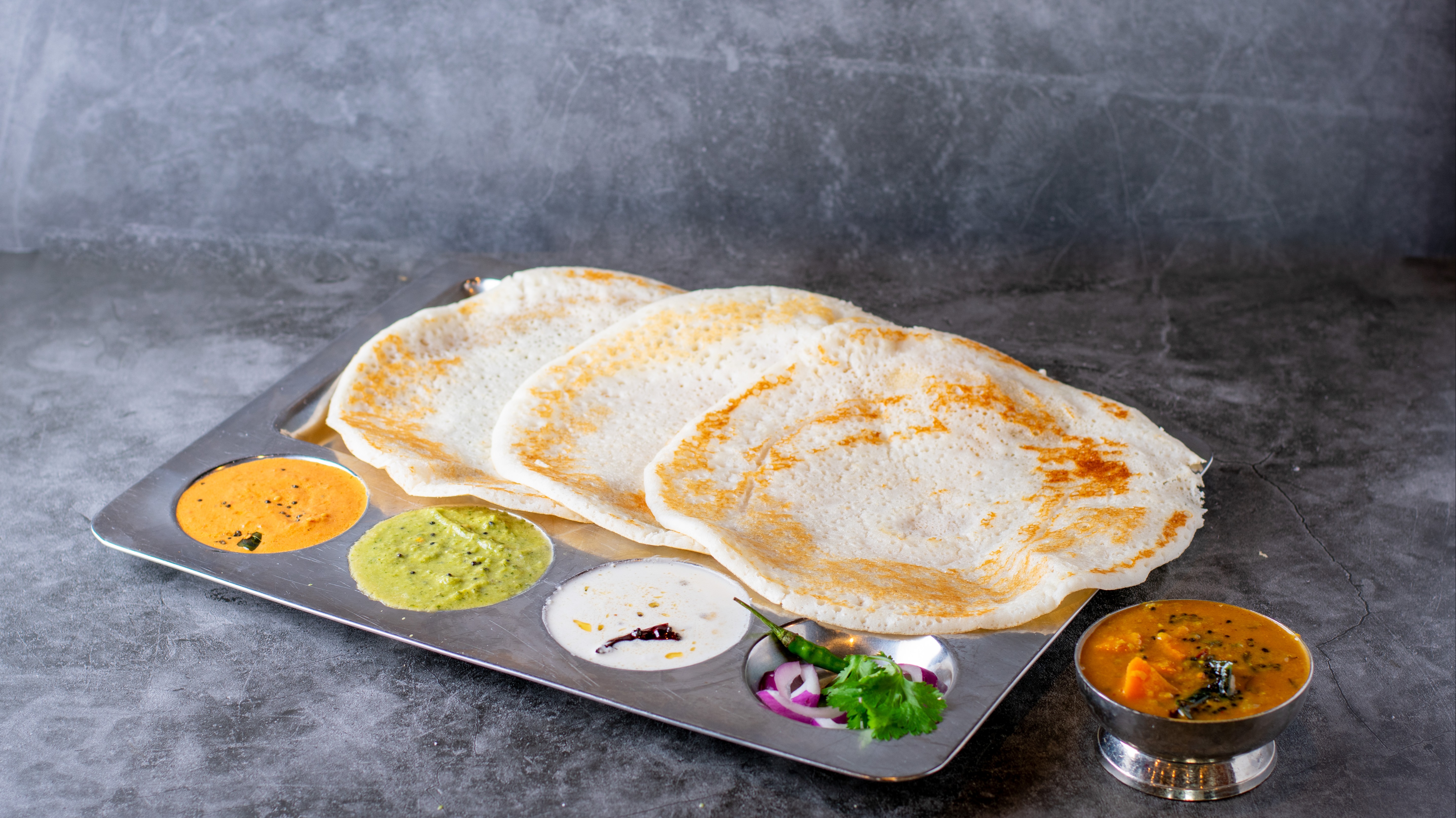 Order Kal Dosa - 3 Pieces food online from Sangam Chettinad Indian Cuisine store, Austin on bringmethat.com