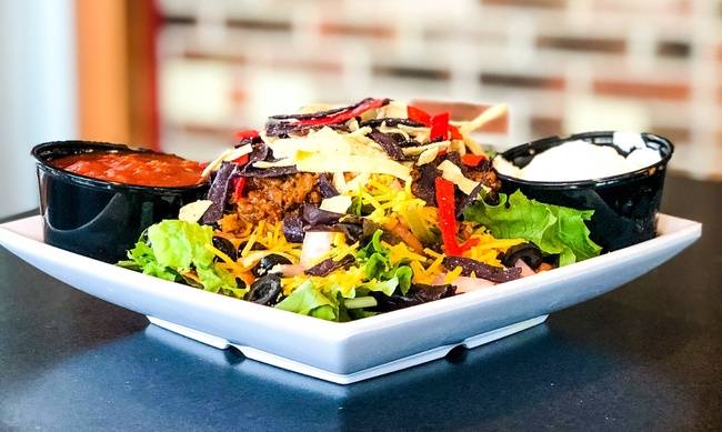 Order Monk's Taco Salad food online from Monk's Bar & Grill store, Middleton on bringmethat.com