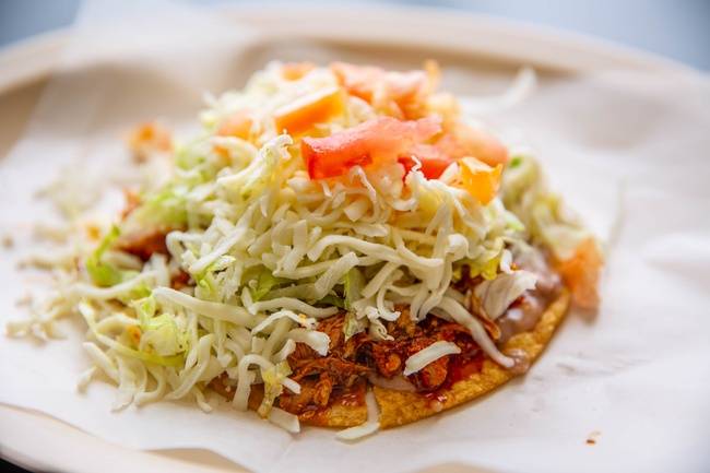 Order Pastor Tostada food online from El Famous Burrito store, Glendale Heights on bringmethat.com
