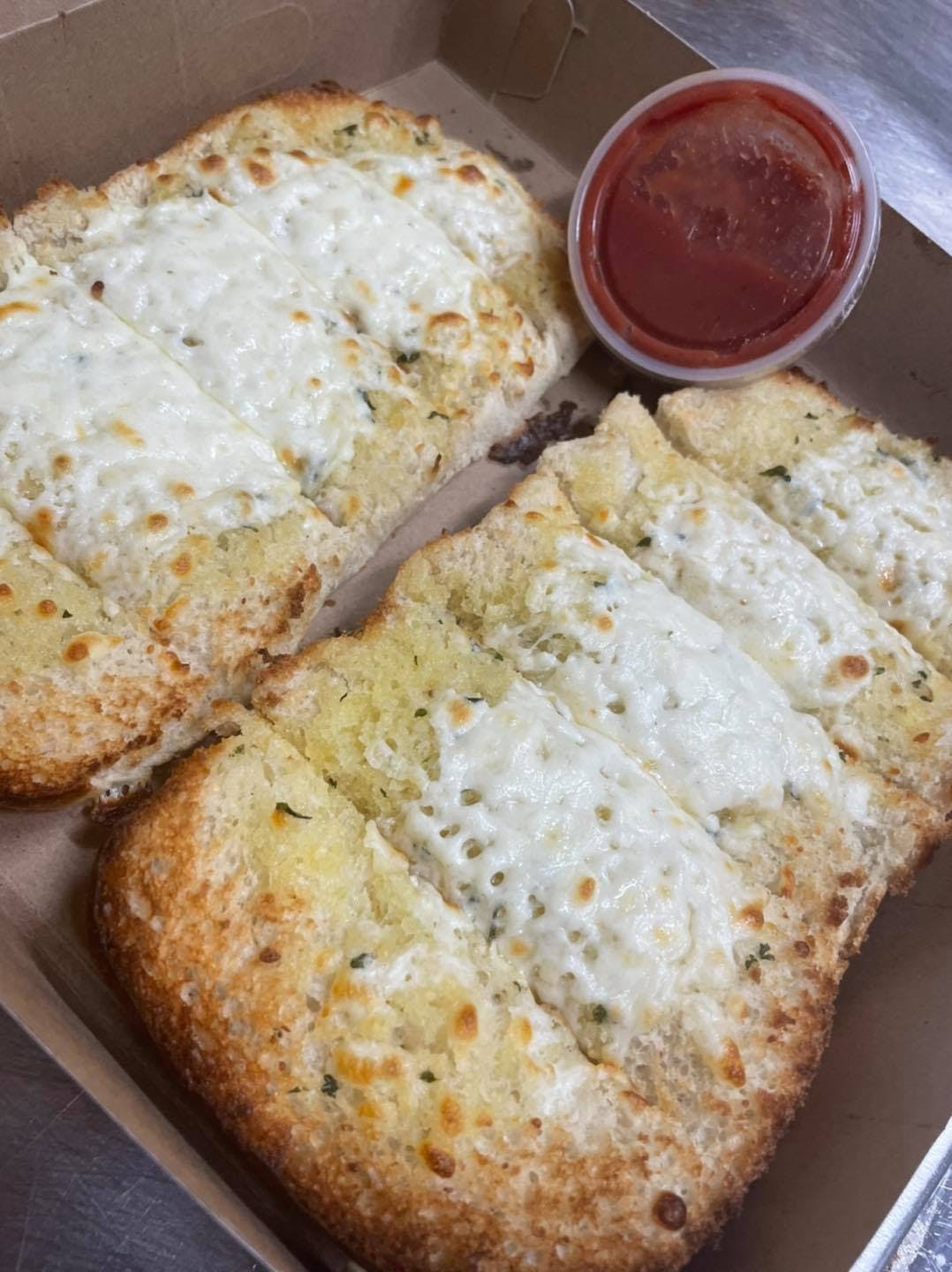 Order Garlic Bread with Cheese - Side food online from Paesano Pizza & Subs store, Elmira on bringmethat.com