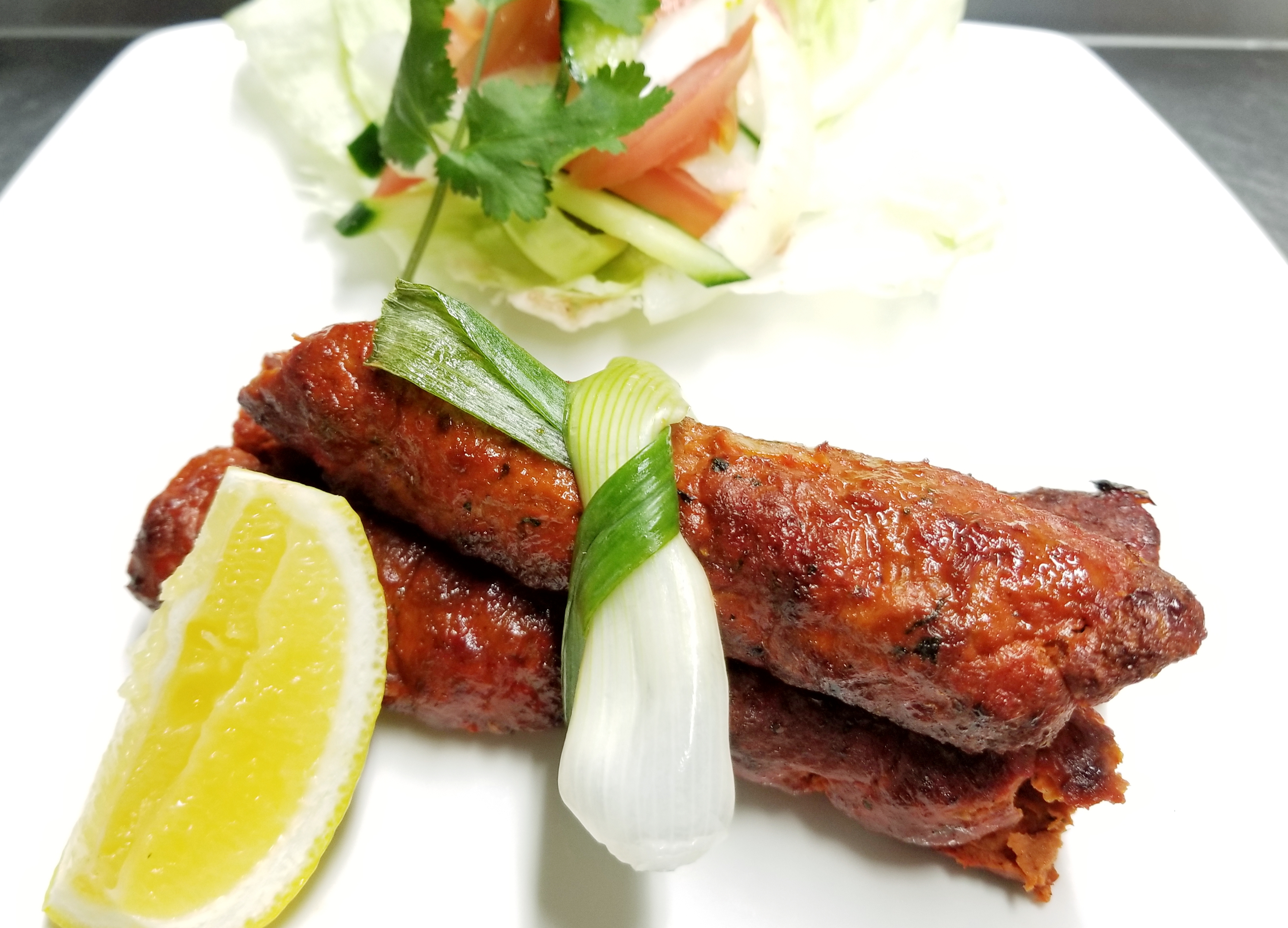 Order 2 Pieces Lamb Seekh Kabab food online from Maroosh Halal Cuisine store, Upper Darby on bringmethat.com