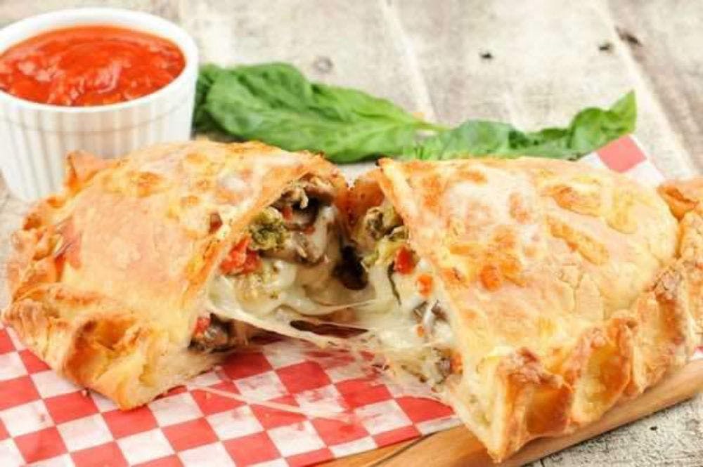 Order Two Toppings Calzone - Calzone food online from House Of Pizza store, San Antonio on bringmethat.com