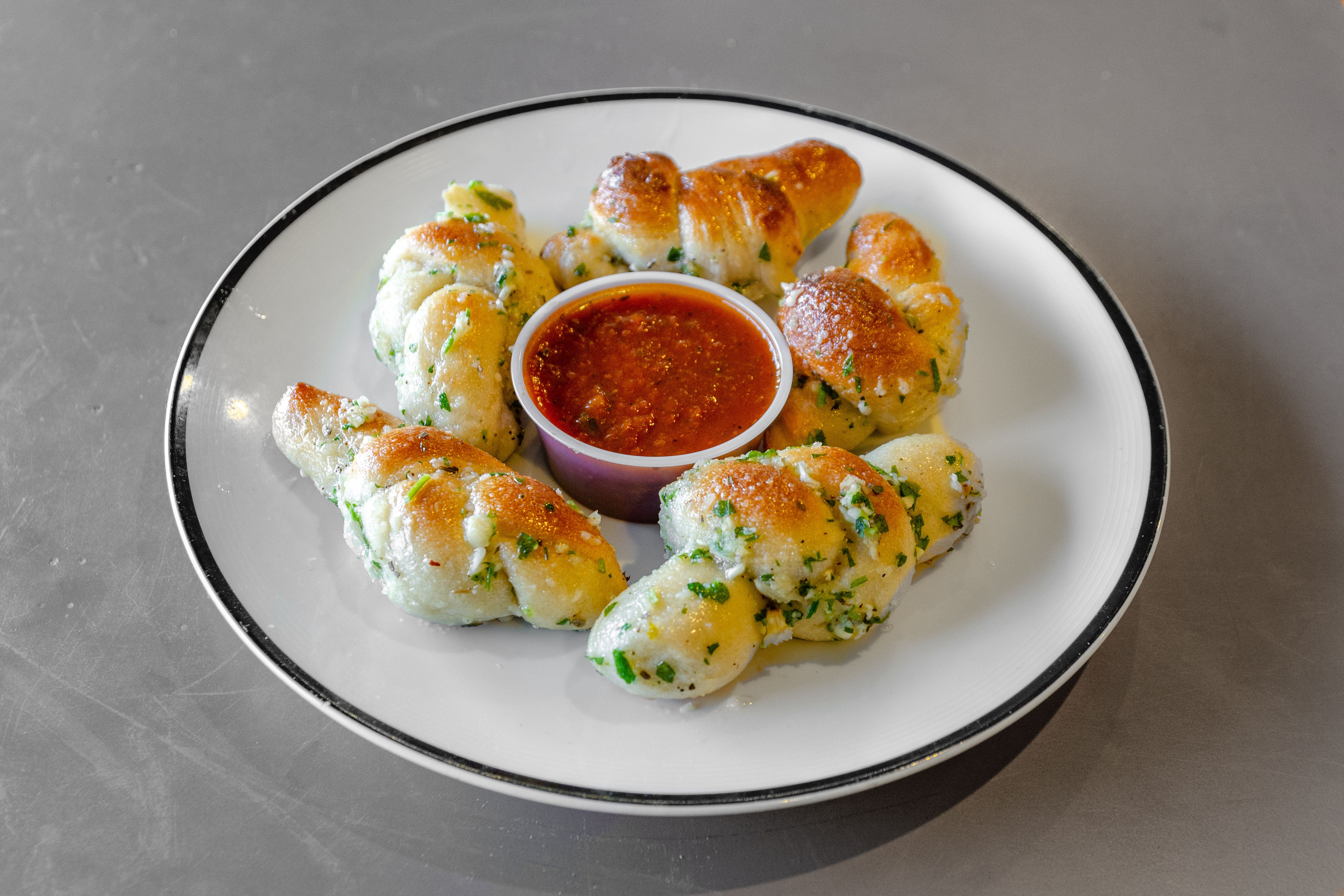 Order Garlic Knots - 5 Pieces food online from Piazza pizza store, Astoria on bringmethat.com