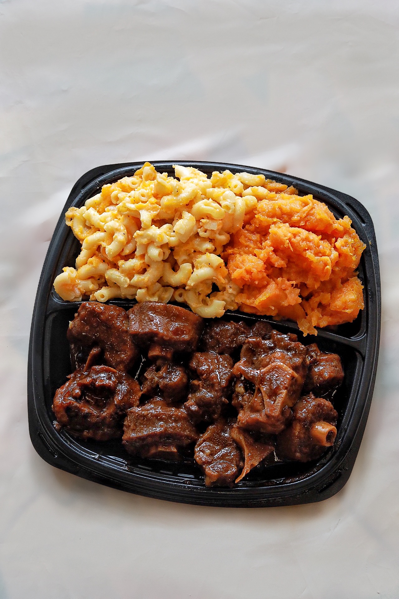 Order Small Oxtail Stew Dinner Combo Plate food online from Flava Kitchen And Catering store, Mt Vernon on bringmethat.com