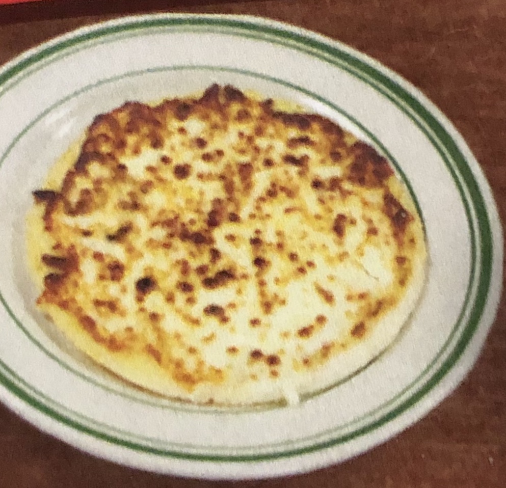 Order Arepa con Queso / Corn Cake with Cheese food online from Mr. Mario store, College Point on bringmethat.com