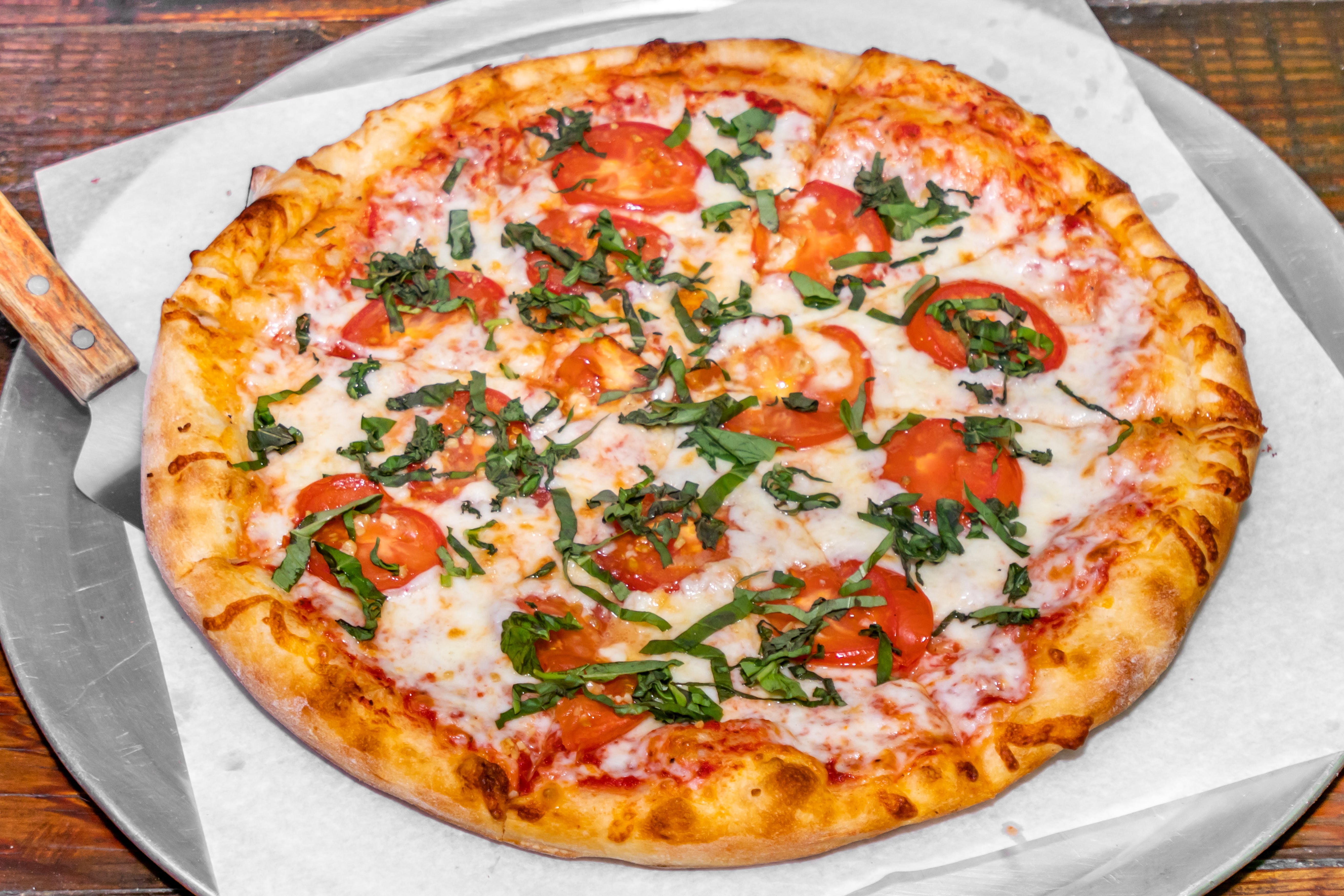 Order Margarita Pizza - 14" food online from Brothers Pizza store, Las Vegas on bringmethat.com