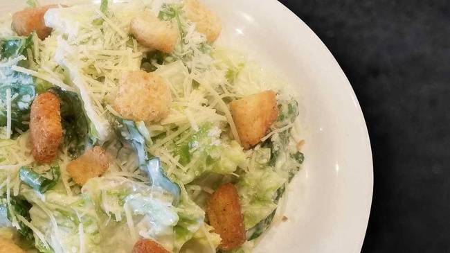 Order Caesar Salad (Individual) food online from Round Table Pizza store, San Leandro on bringmethat.com