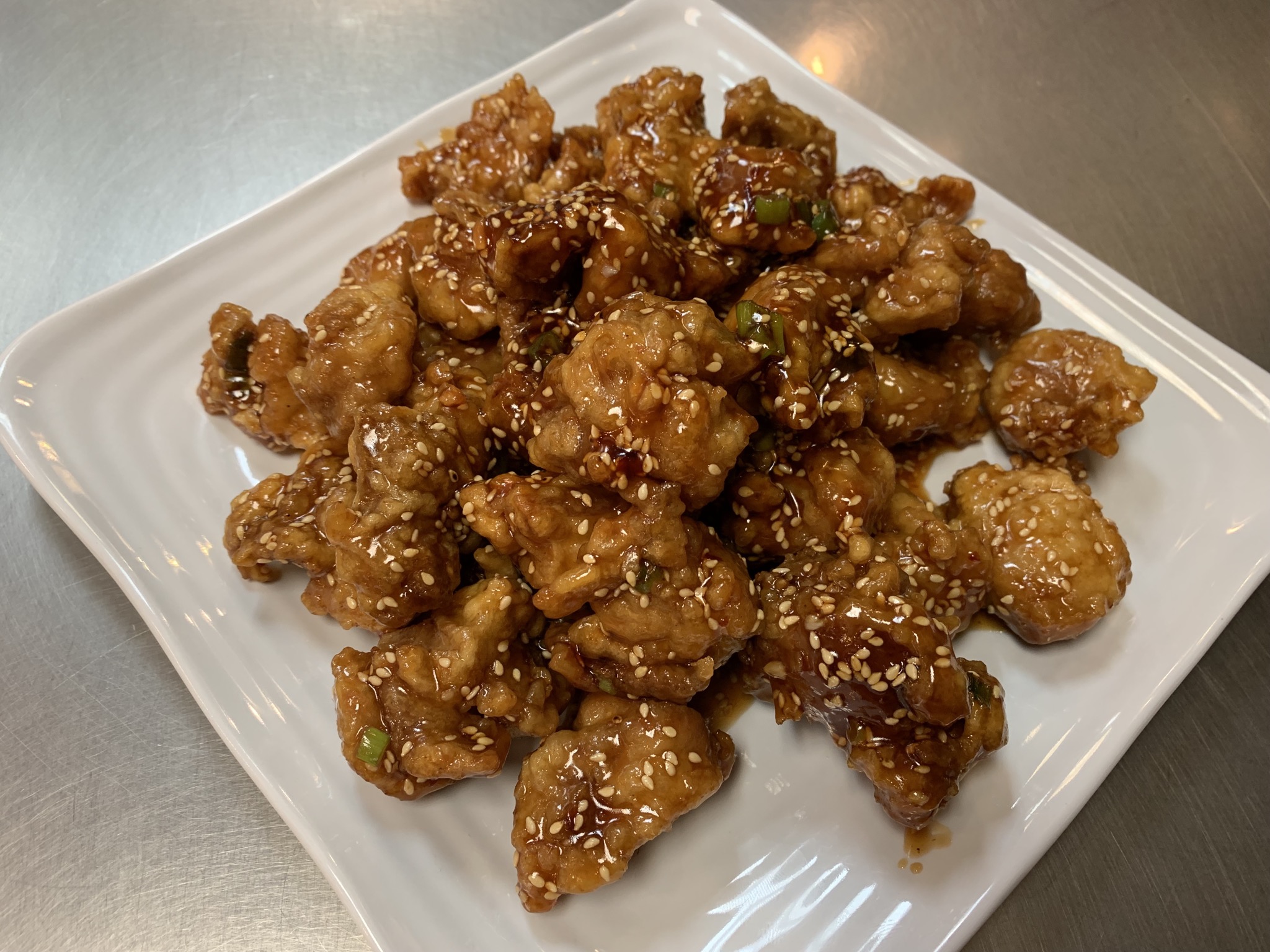Order Sesame Chicken Entree food online from China A Go Go store, Las Vegas on bringmethat.com
