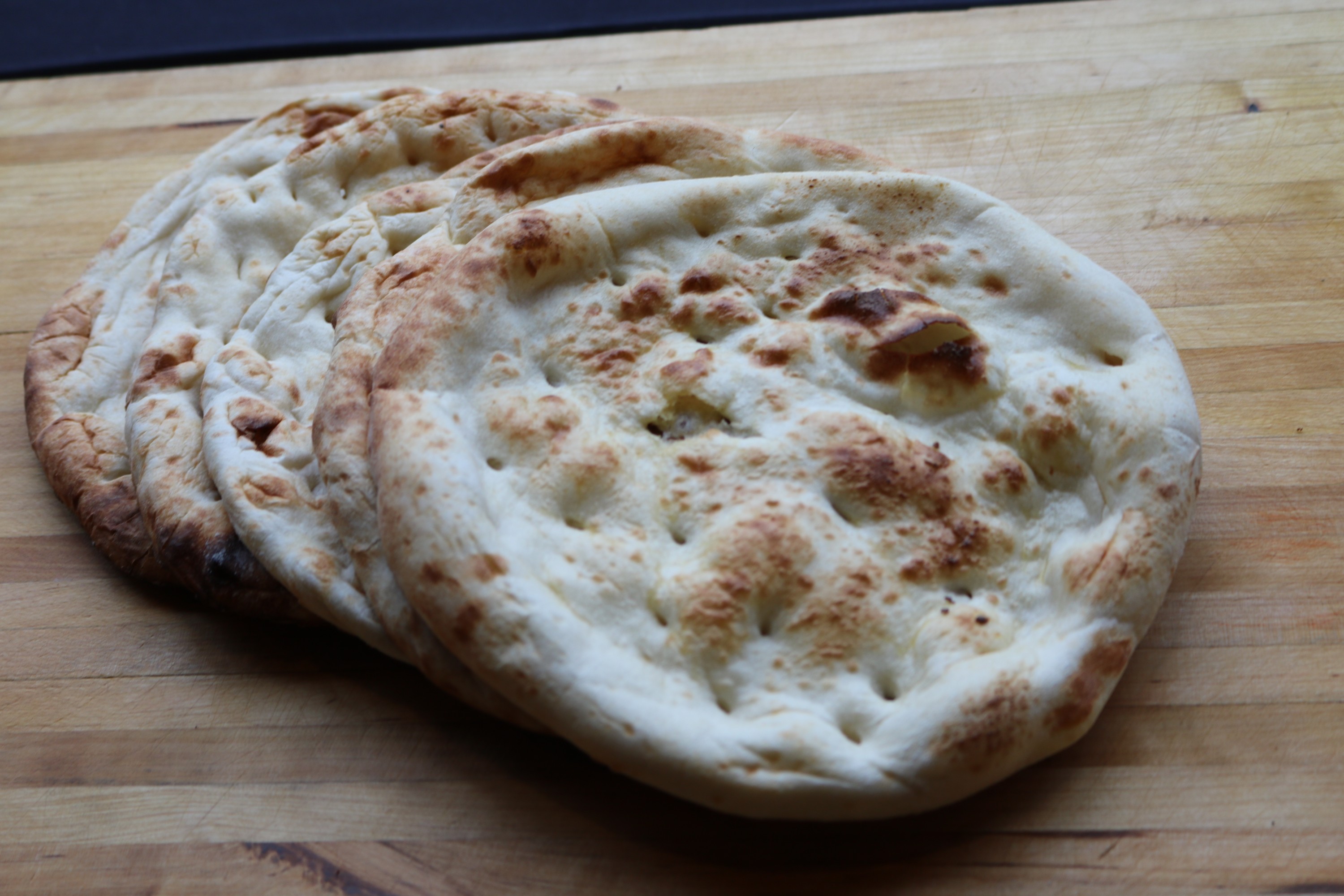 Order Butter Naan food online from Anmol Restaurant store, Milwaukee on bringmethat.com