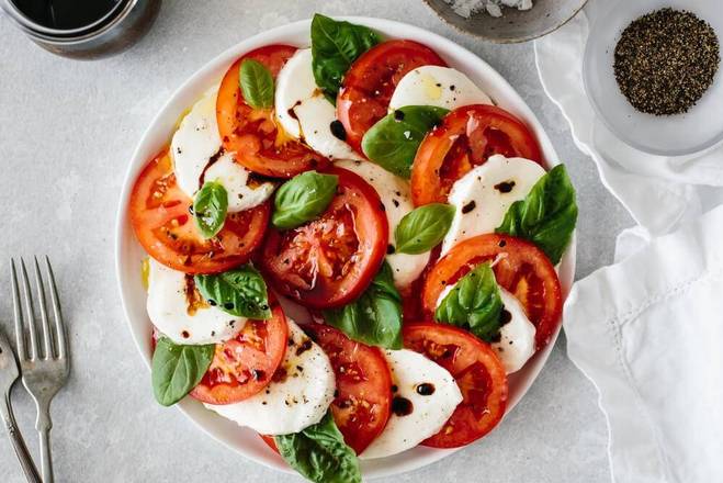 Order Caprese Salad food online from East and Feast Lounge store, Austin on bringmethat.com