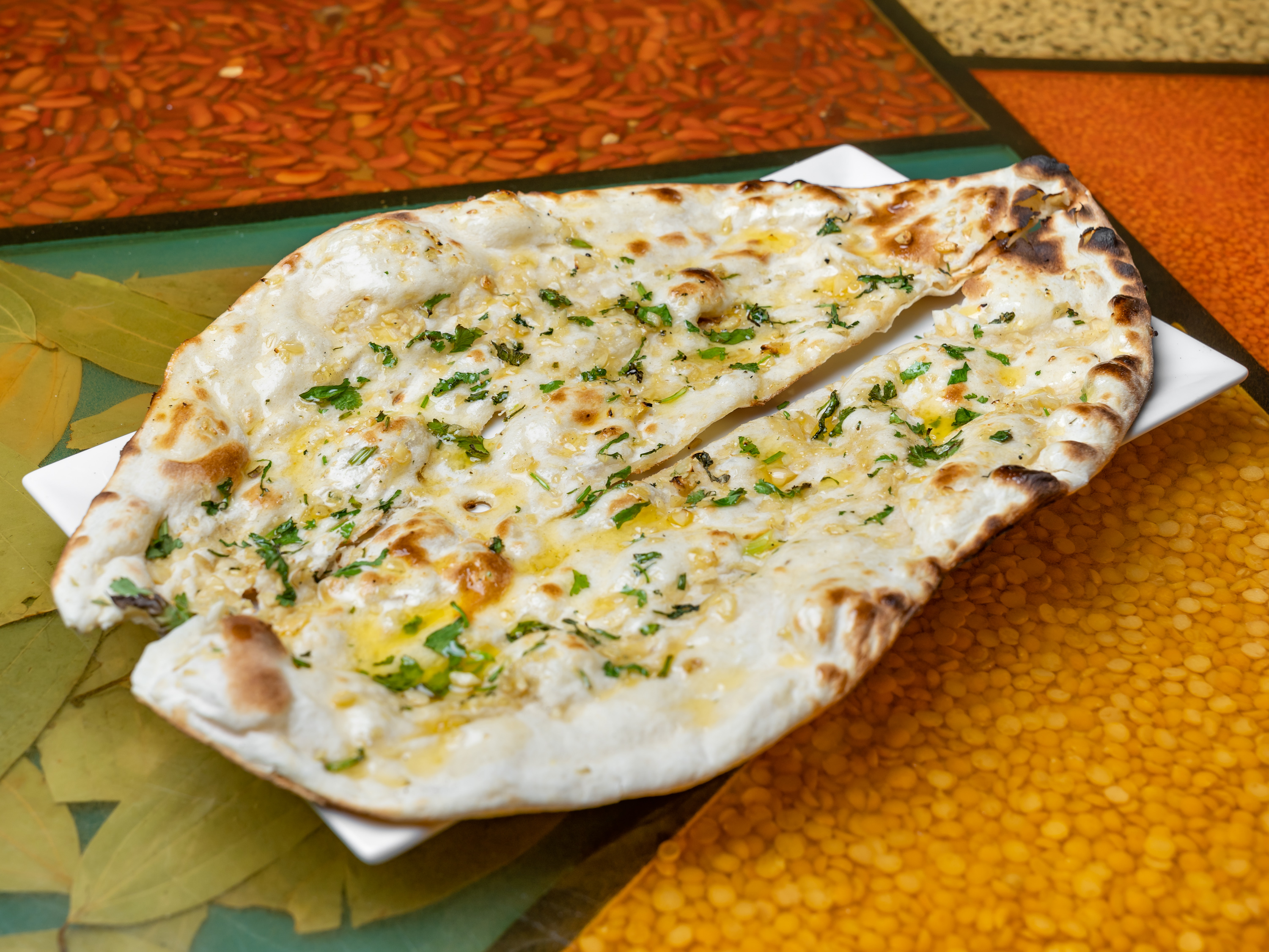 Order Garlic Naan food online from Singhs Cafe store, Wellesley Hills on bringmethat.com
