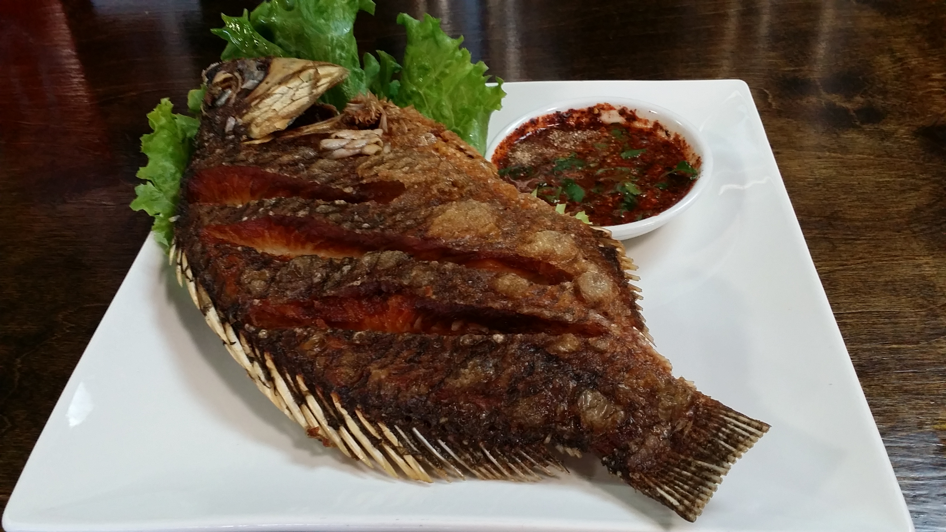 Order Pla Tod (Fried Tilapia) food online from Thai Lily Cafe store, Houston on bringmethat.com