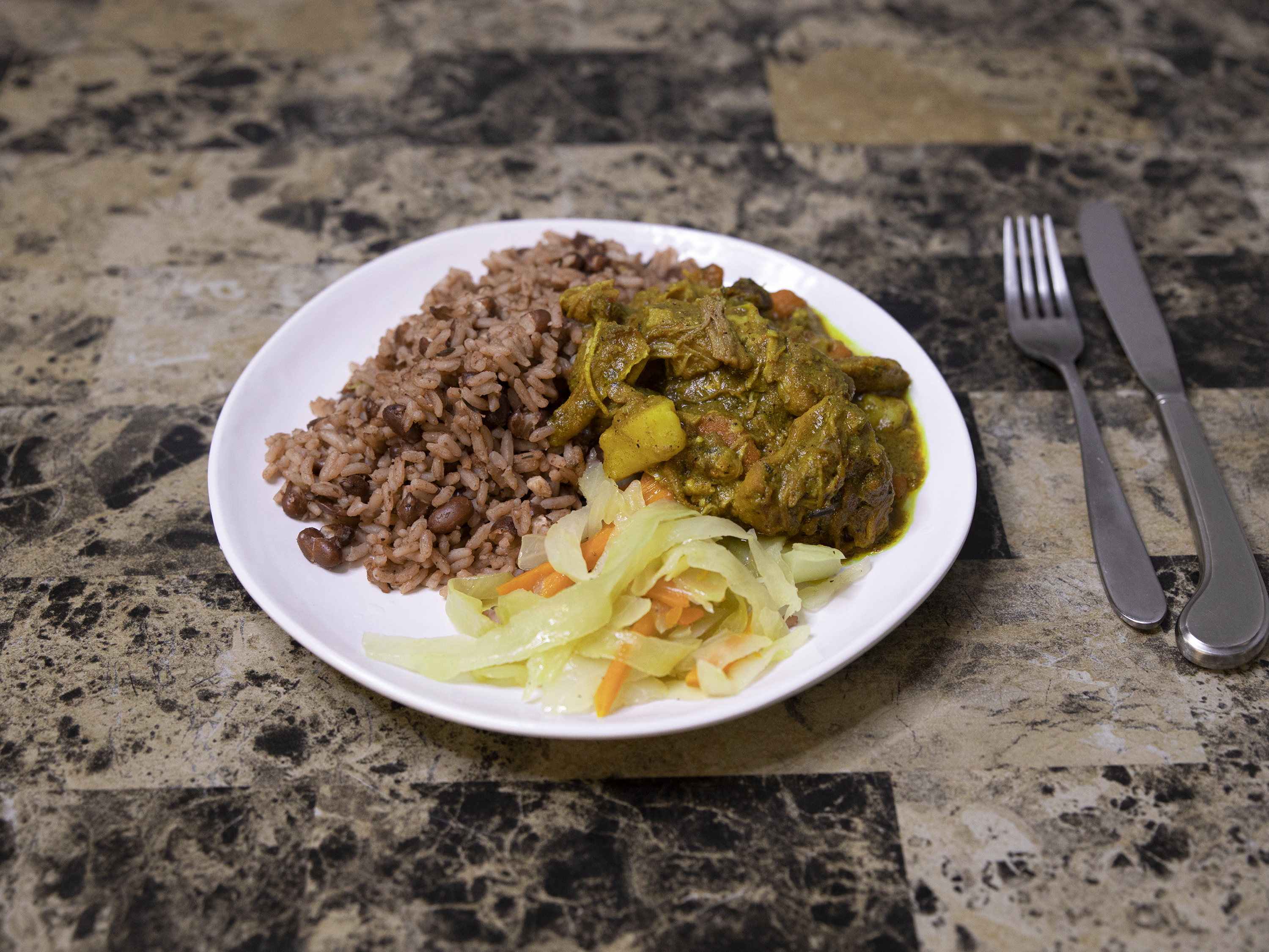 Order Curry Chicken food online from Negril Caribbean Restaurant store, Wilmington on bringmethat.com