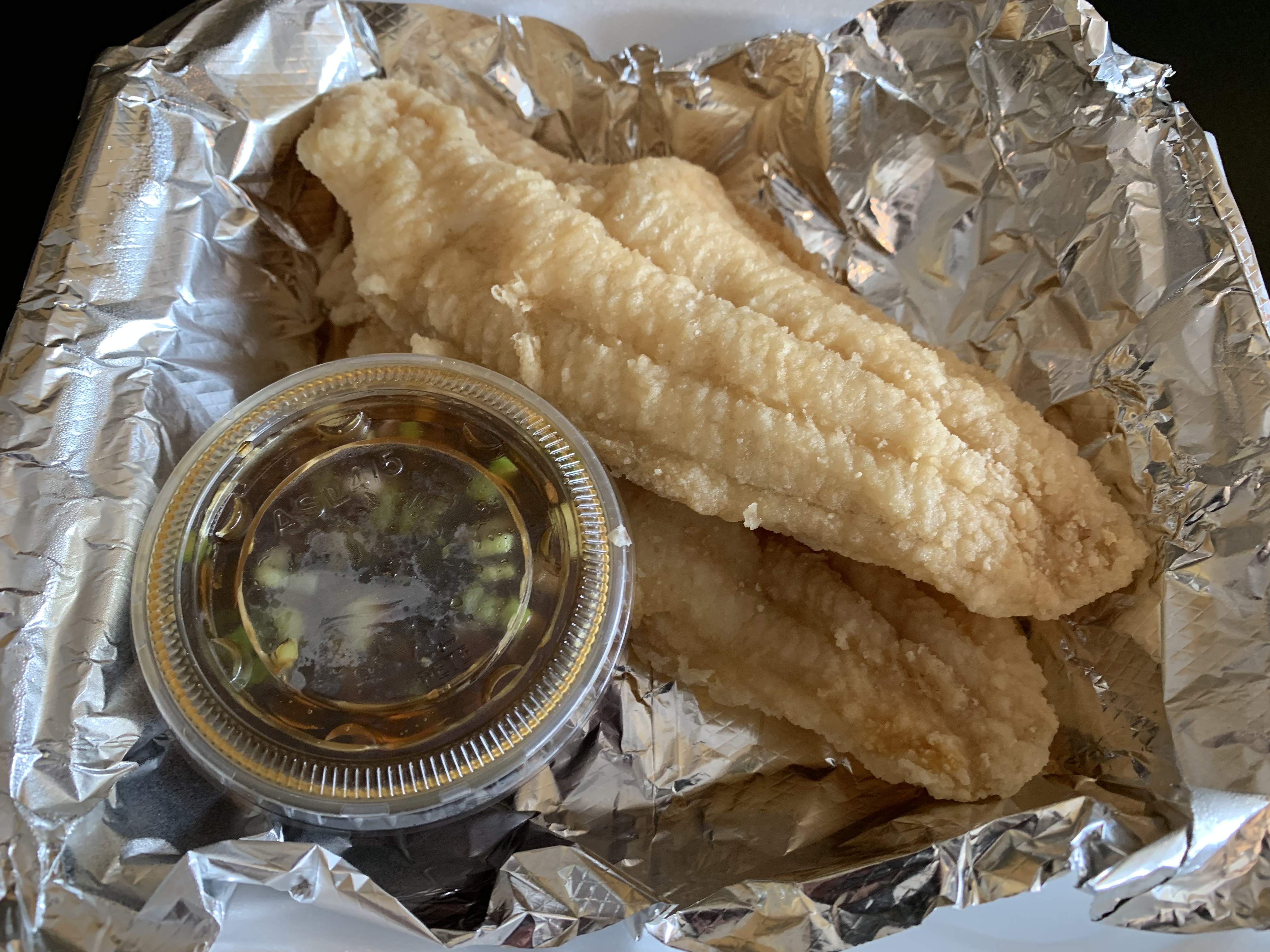 Order C2. Fried Catfish food online from Thai Basil & Sushi store, Trussville on bringmethat.com