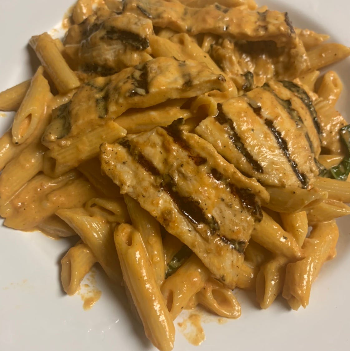 Order Penne a la Vodka with Chicken - Pasta food online from Taste of Italy Pizzeria store, Corona on bringmethat.com