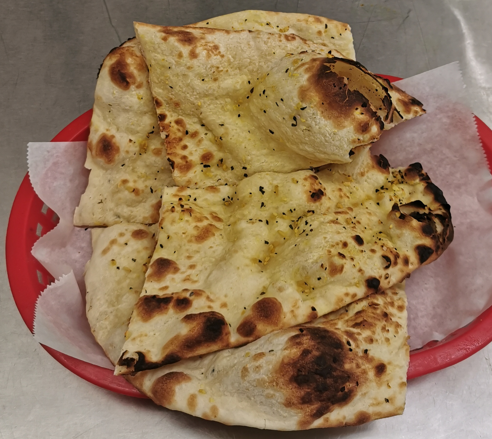 Order Garlic Naan food online from Indimex Eats Indian Restaurant store, Los Angeles on bringmethat.com