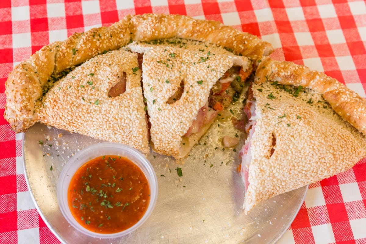 Order BBQ Chicken Calzone - Calzone food online from Happy Italian Pizzeria store, Harahan on bringmethat.com