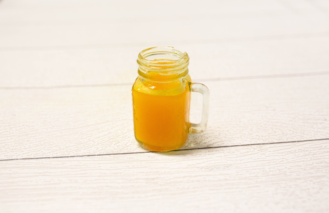 Order Turmeric Shot food online from Grain And Berry store, Nashville on bringmethat.com