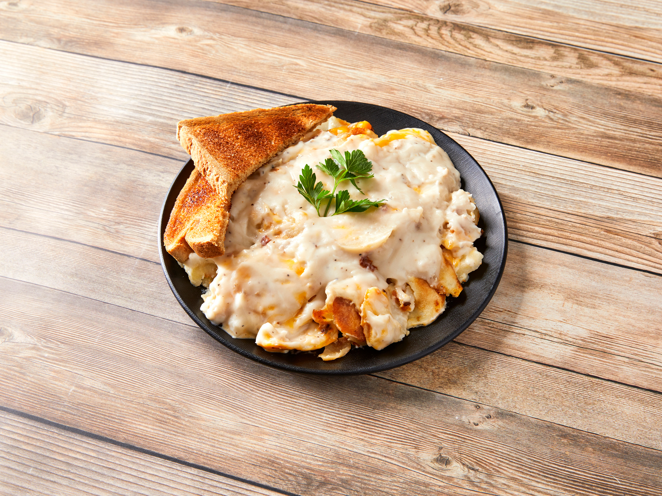Order Potatoes, Sausage Gravy and Cheese food online from Yellow Cat Cafe store, South Bend on bringmethat.com