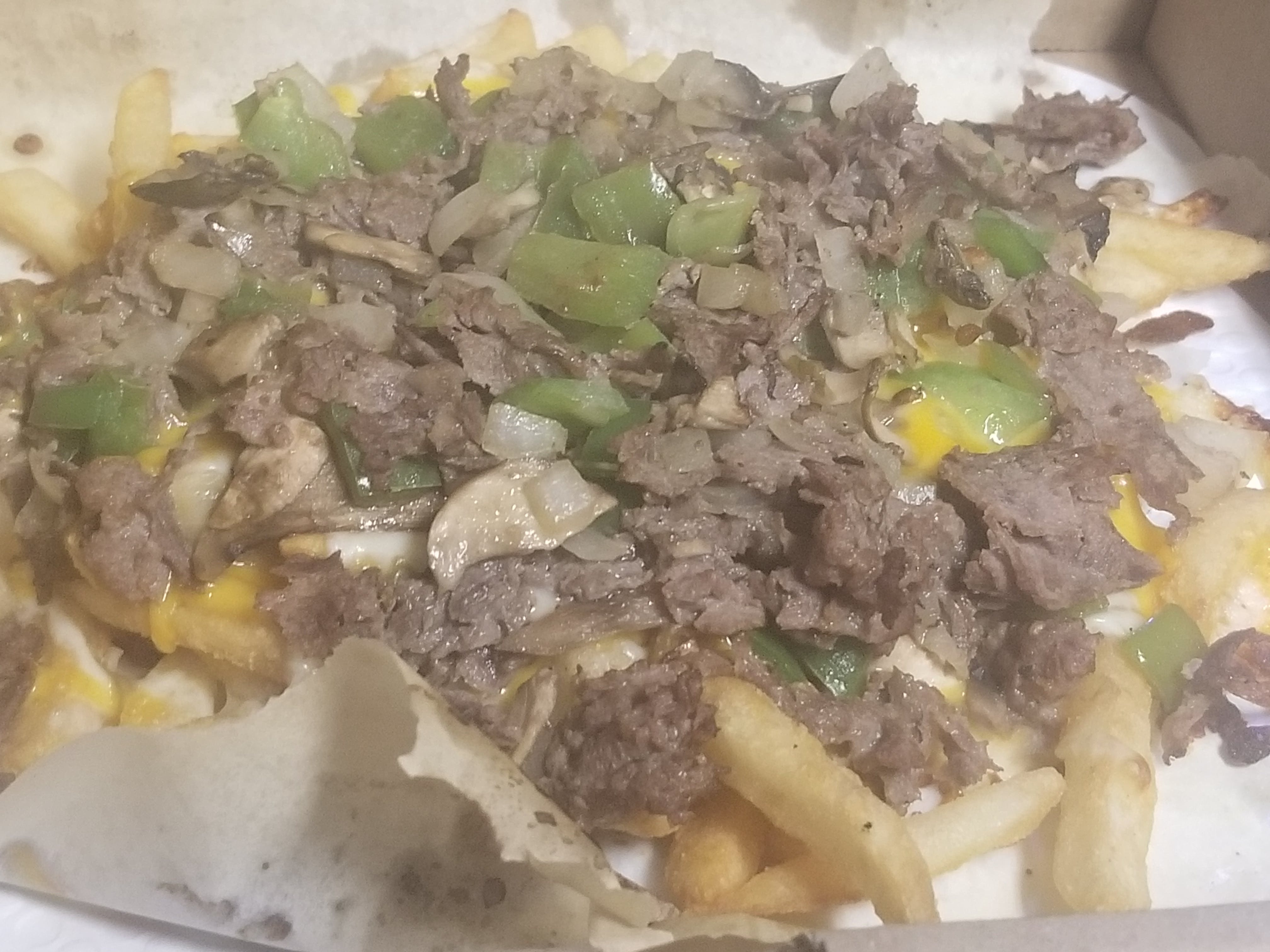 Order Philly Cheesesteak French Fries - Regular food online from Novotny's Groceries & Pizza store, Worthington on bringmethat.com