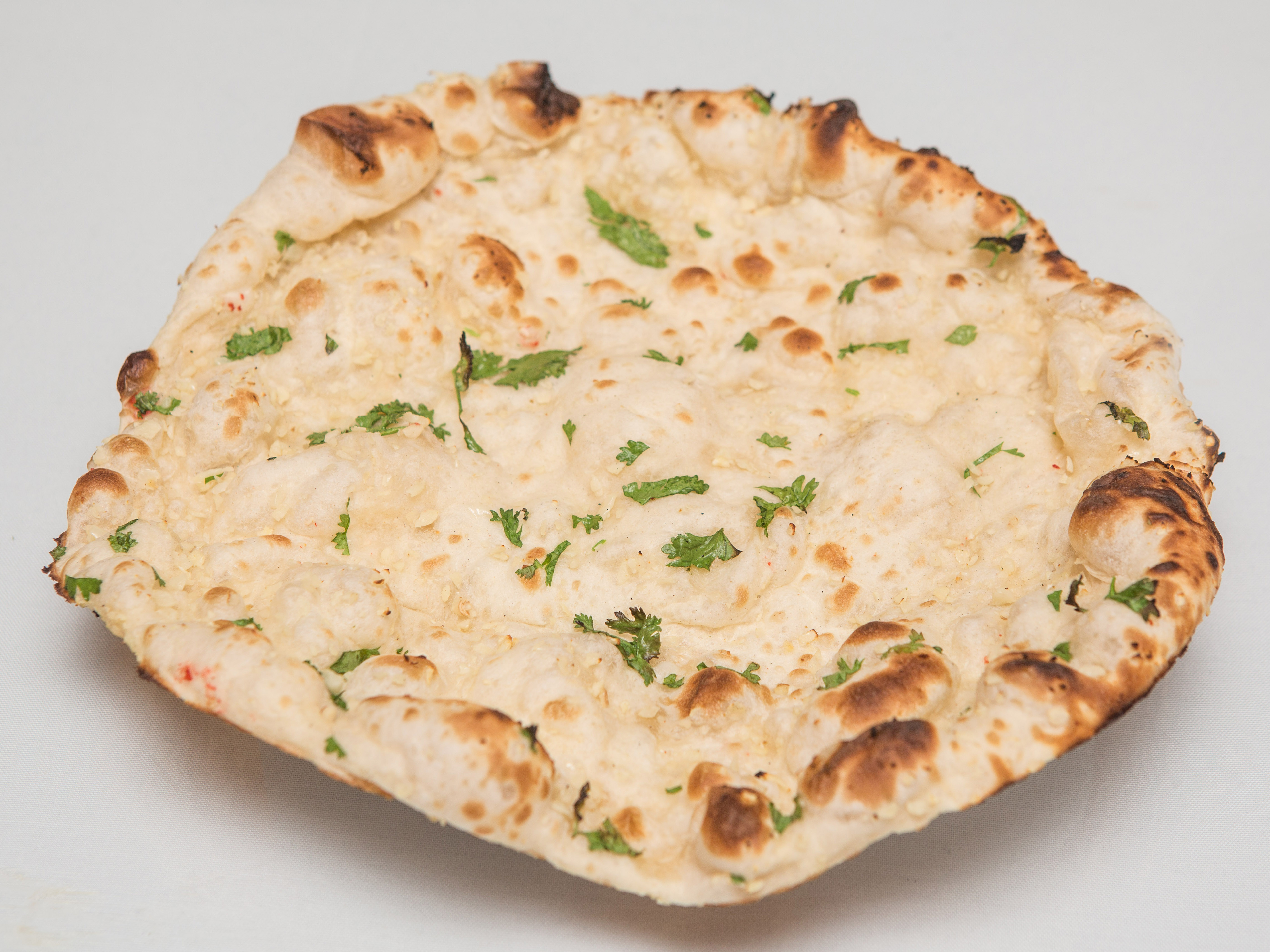 Order Garlic Naan food online from Bombay kitchen store, Brooklyn on bringmethat.com