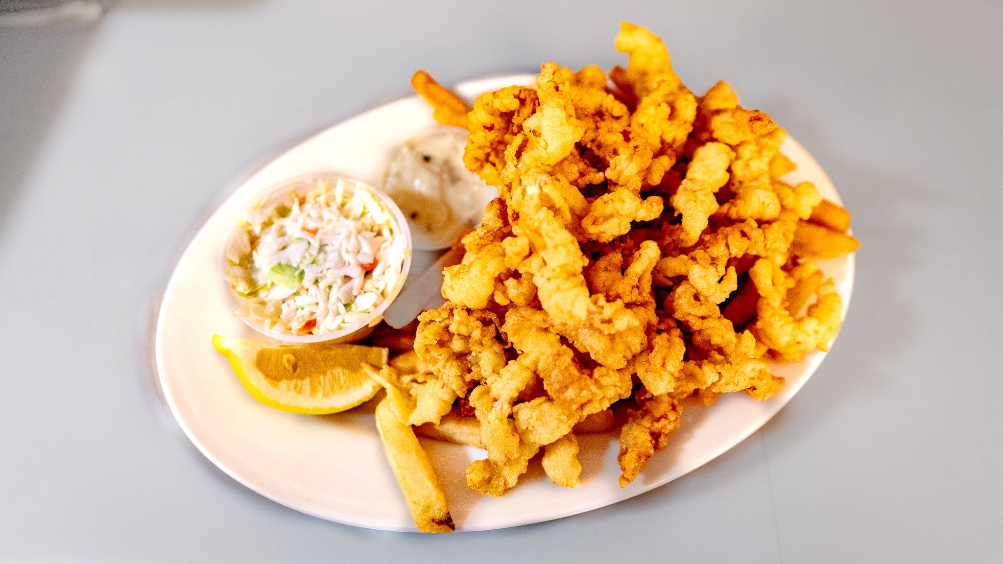 Order Fried Clam Strips - Seafood Dinners food online from Fat Cat Grill & Bar store, Norwich on bringmethat.com