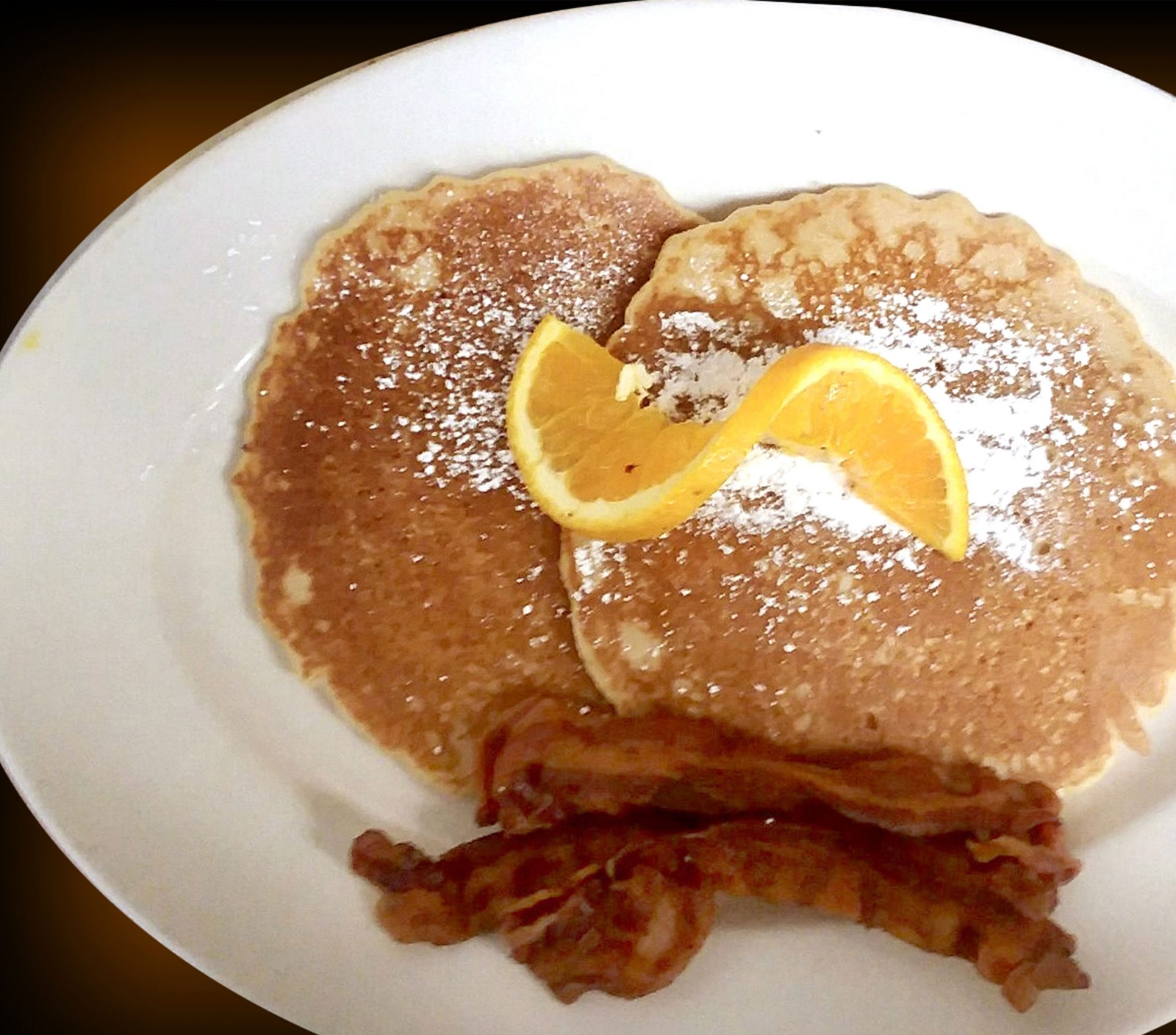 Order 2 Buttermilk Pancakes - with 2 Bacon Strips & 1 Sausage Link food online from Pinocchio In The Desert store, Palm Springs on bringmethat.com