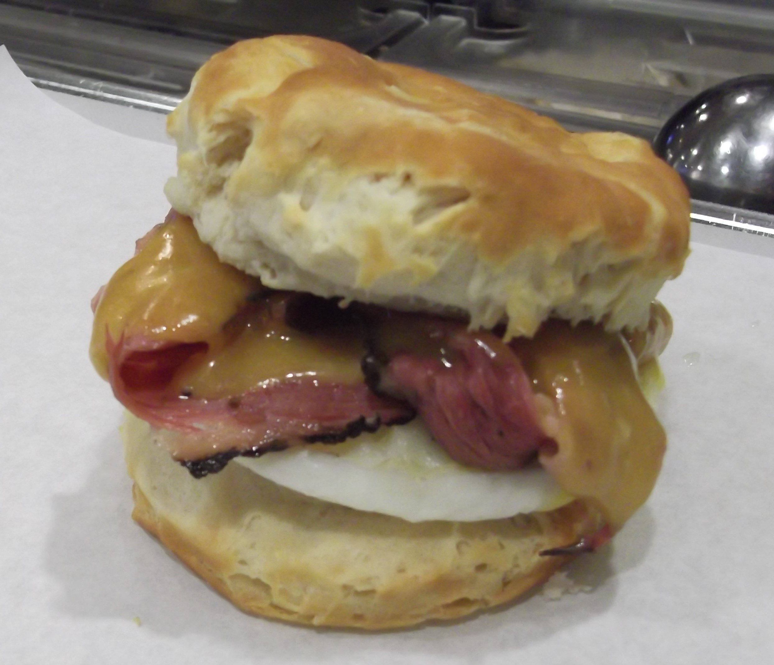 Order Biscuit, Egg and Cheddar Sandwich food online from Mo Deli store, Anchorage on bringmethat.com