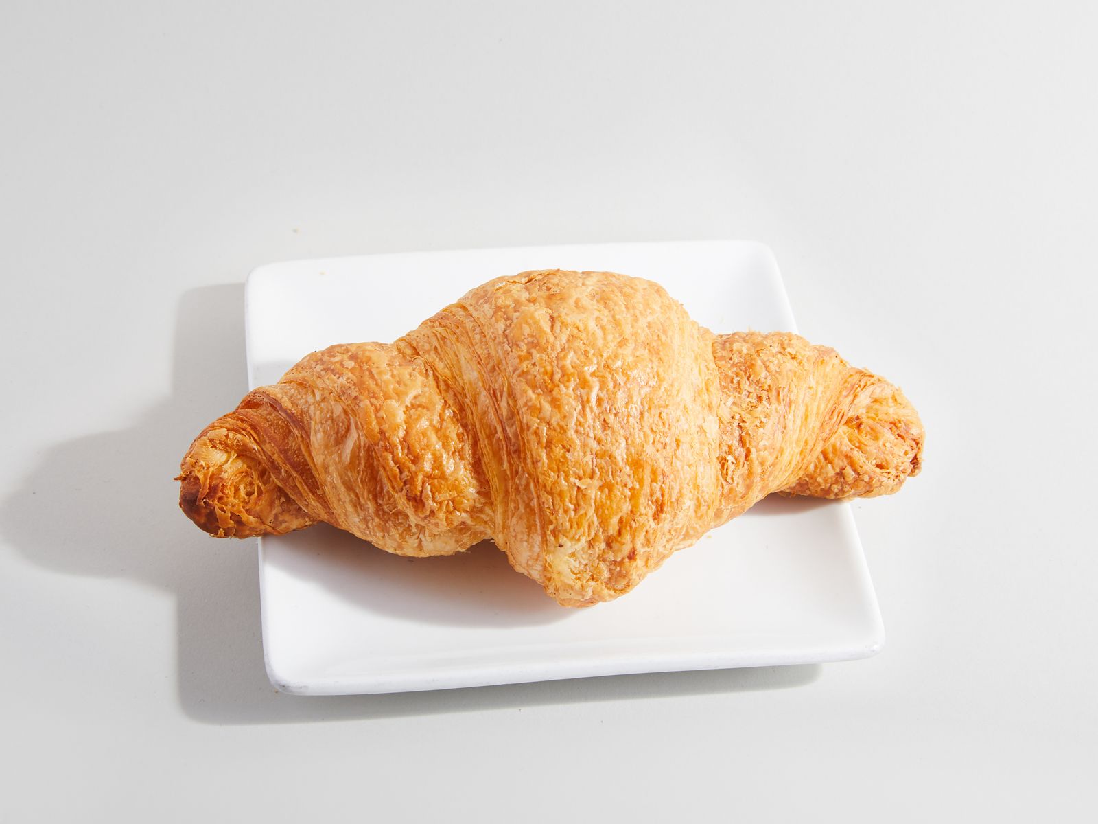 Order Butter Croissant food online from Sweetwaters Coffee & Tea store, Shelby Charter Township on bringmethat.com