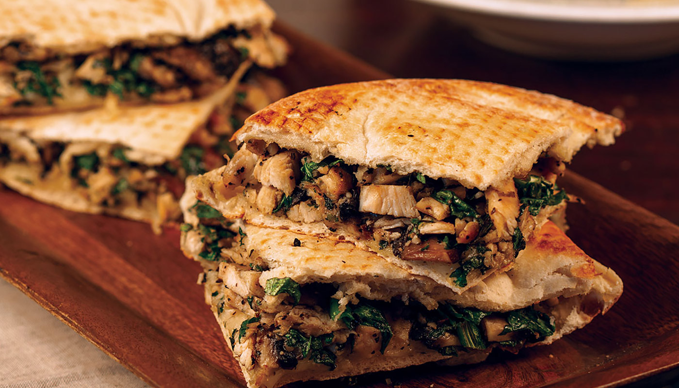 Order Chicken Tuscan Flatbread Sandwich food online from Russo's New York Pizzeria store, Houston on bringmethat.com