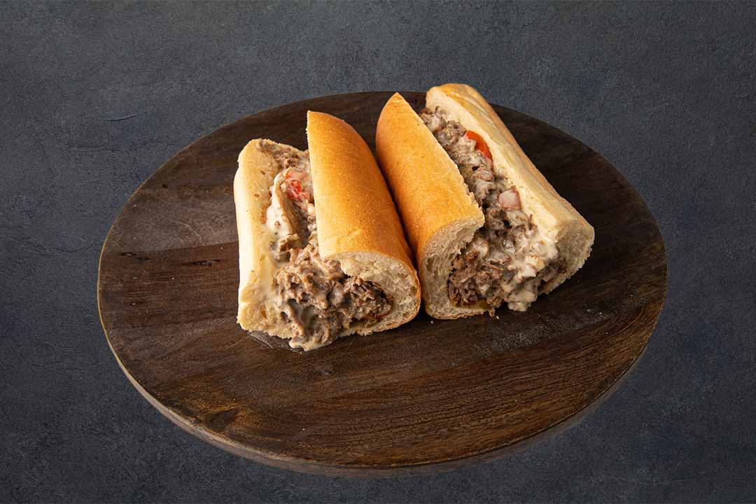Order Philly Steak Deluxe Sandwich - Full food online from Westshore Pizza store, Tampa on bringmethat.com